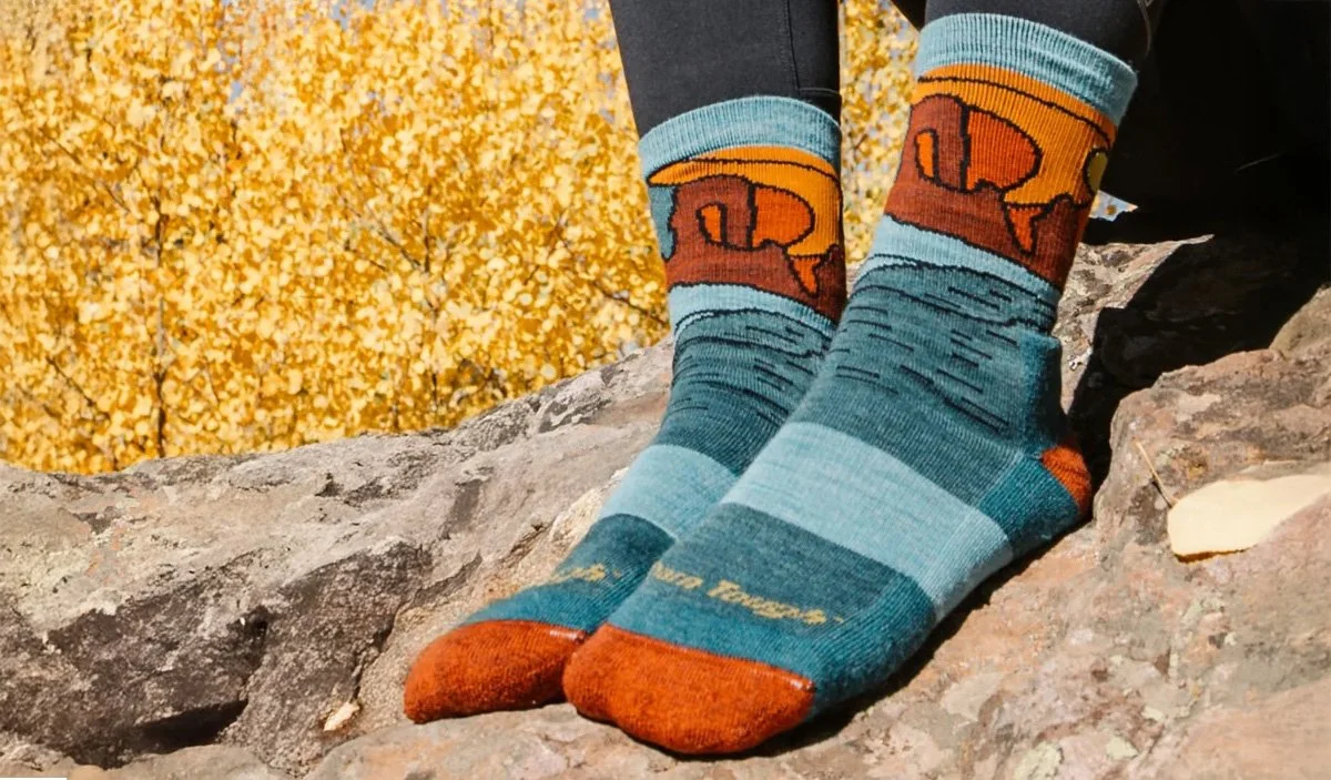 Wearing Darn Tough Celeste socks with shoes off