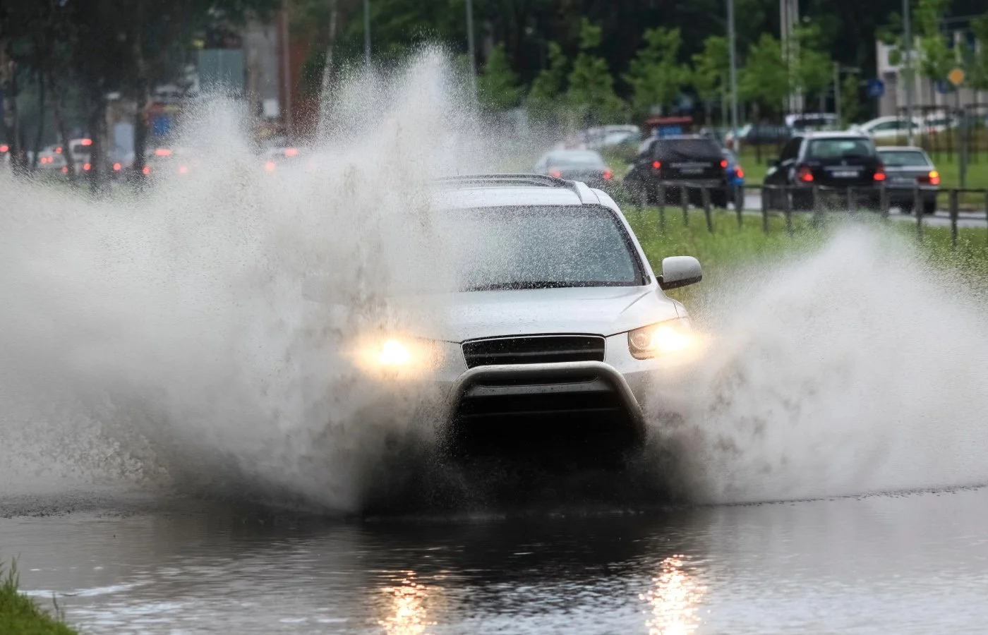 a car going through a big puddle of water