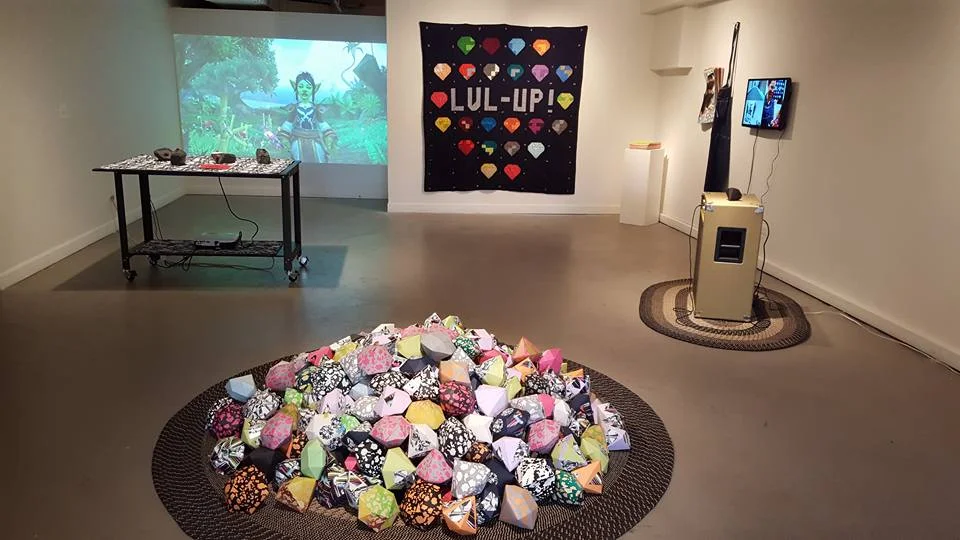 Installation view of Quest! , 2016. Features two installations, LVL-UP! (right and foreground) and Choose Your Own Adventure (left, background).