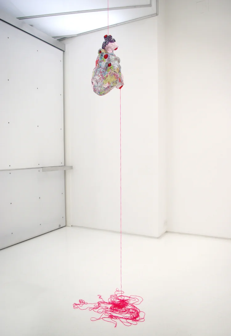 Incidentalomas for group exhibition Paper City (Mixed Greens Gallery, NYC). Paper mache heart covered in thousands of dots punched from original digital print, twine. 2008.
