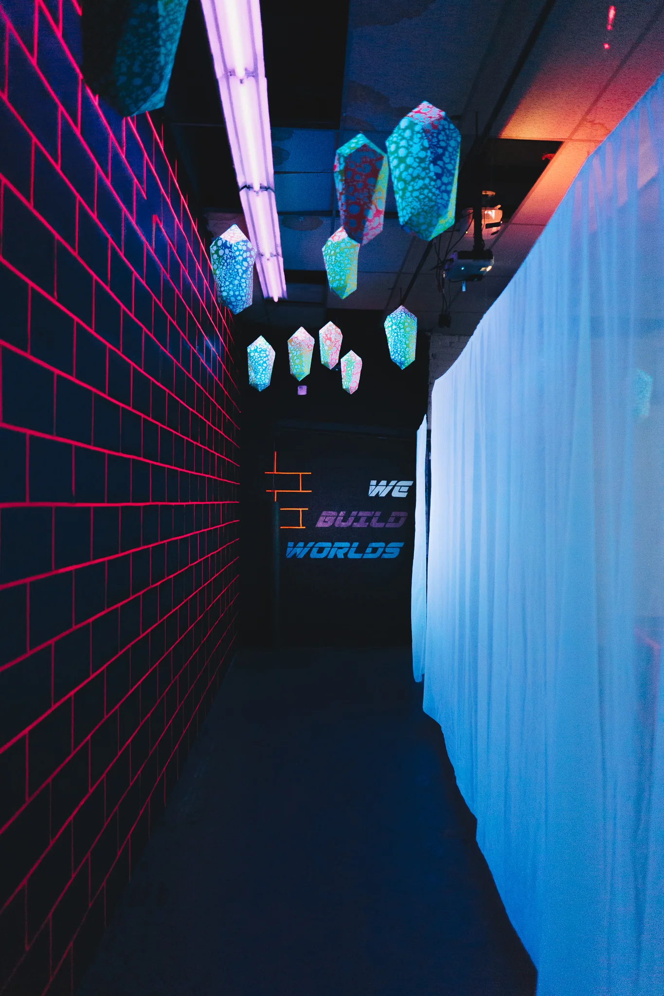 Installation view, WE BUILD WORLDS