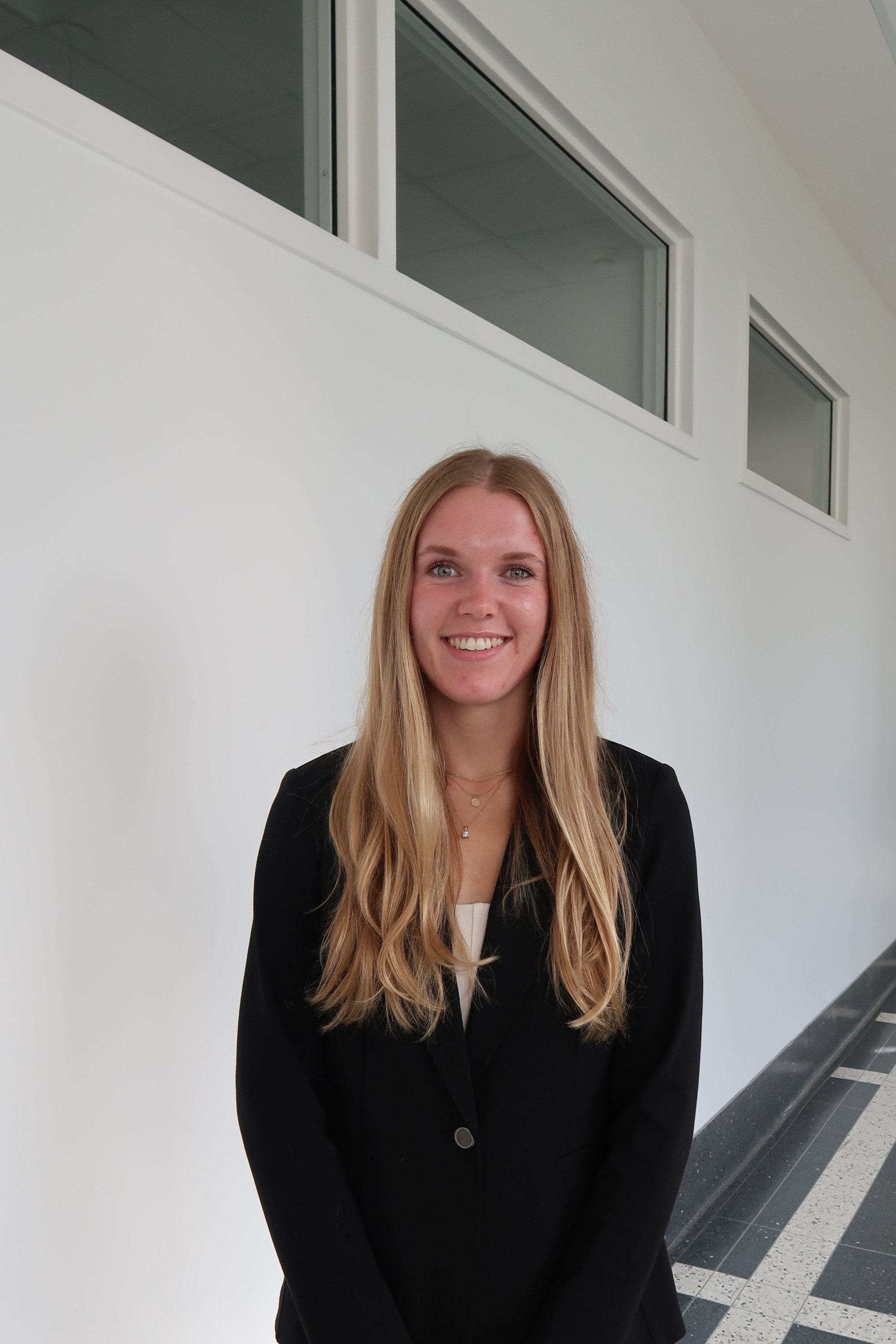 MEGAN FELTNER, DIRECTOR