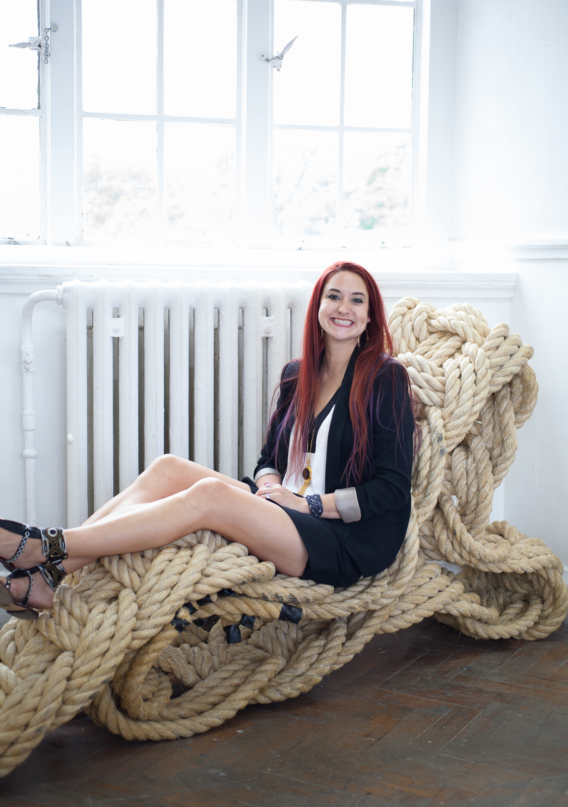The artist sitting on her piece Apotropaic , 2013. Photography credit: Emma Robinson.