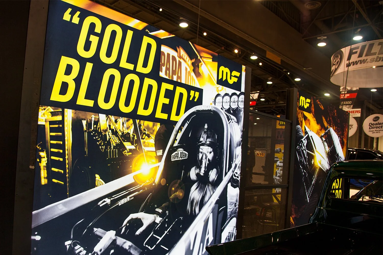 Francisco Anduiza, Jr., Senior Graphic Designer, MagnaFlow SEMA trade show booth featuring Leah Pritchett graphic display