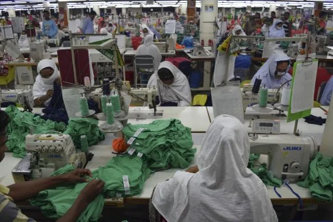 Still of Bangladeshi women in sweatshop from The True Cost