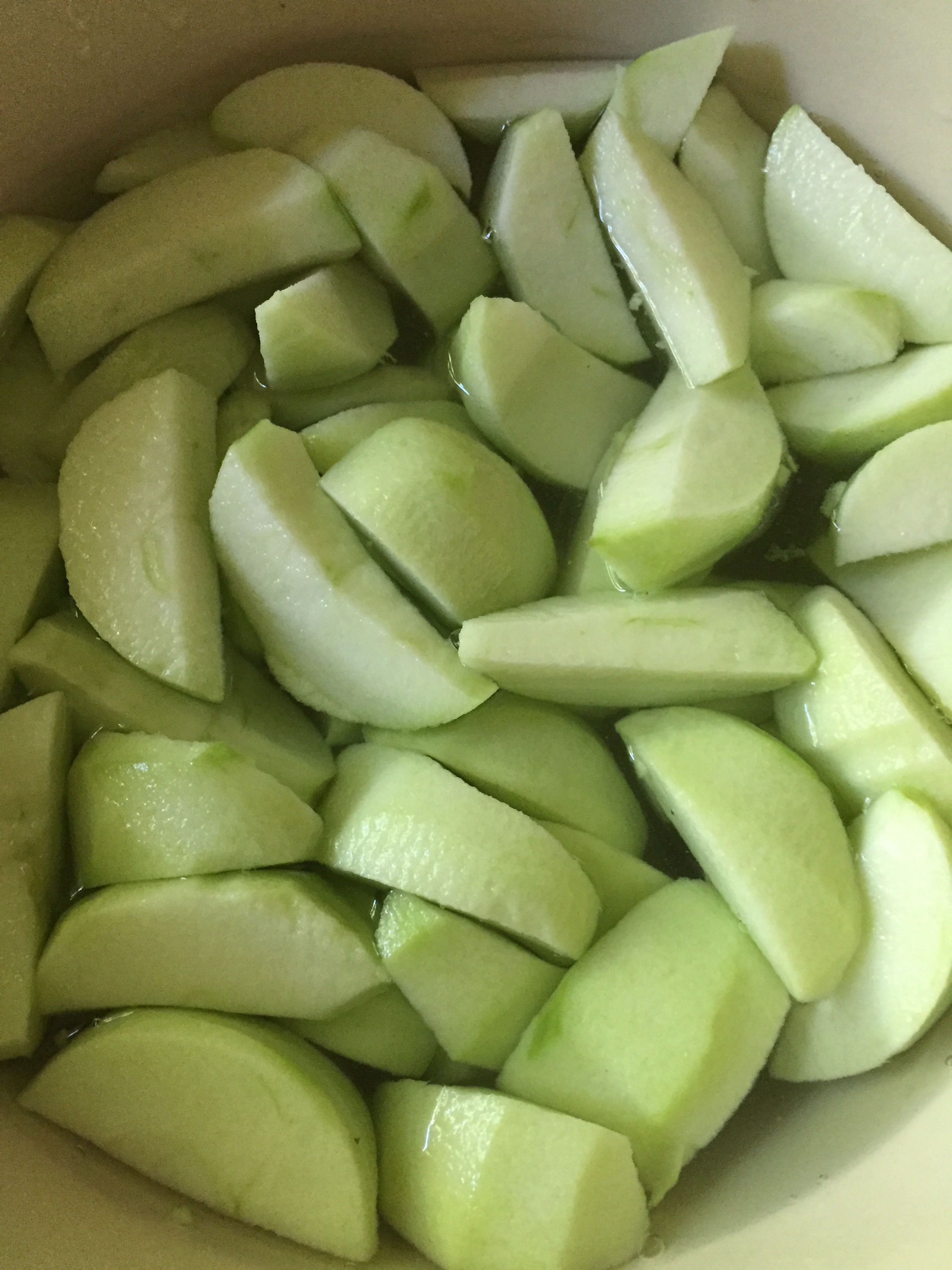The apples soaking in a water bath with a little Ball 'fruit fresh' mixed in to keep them from browning