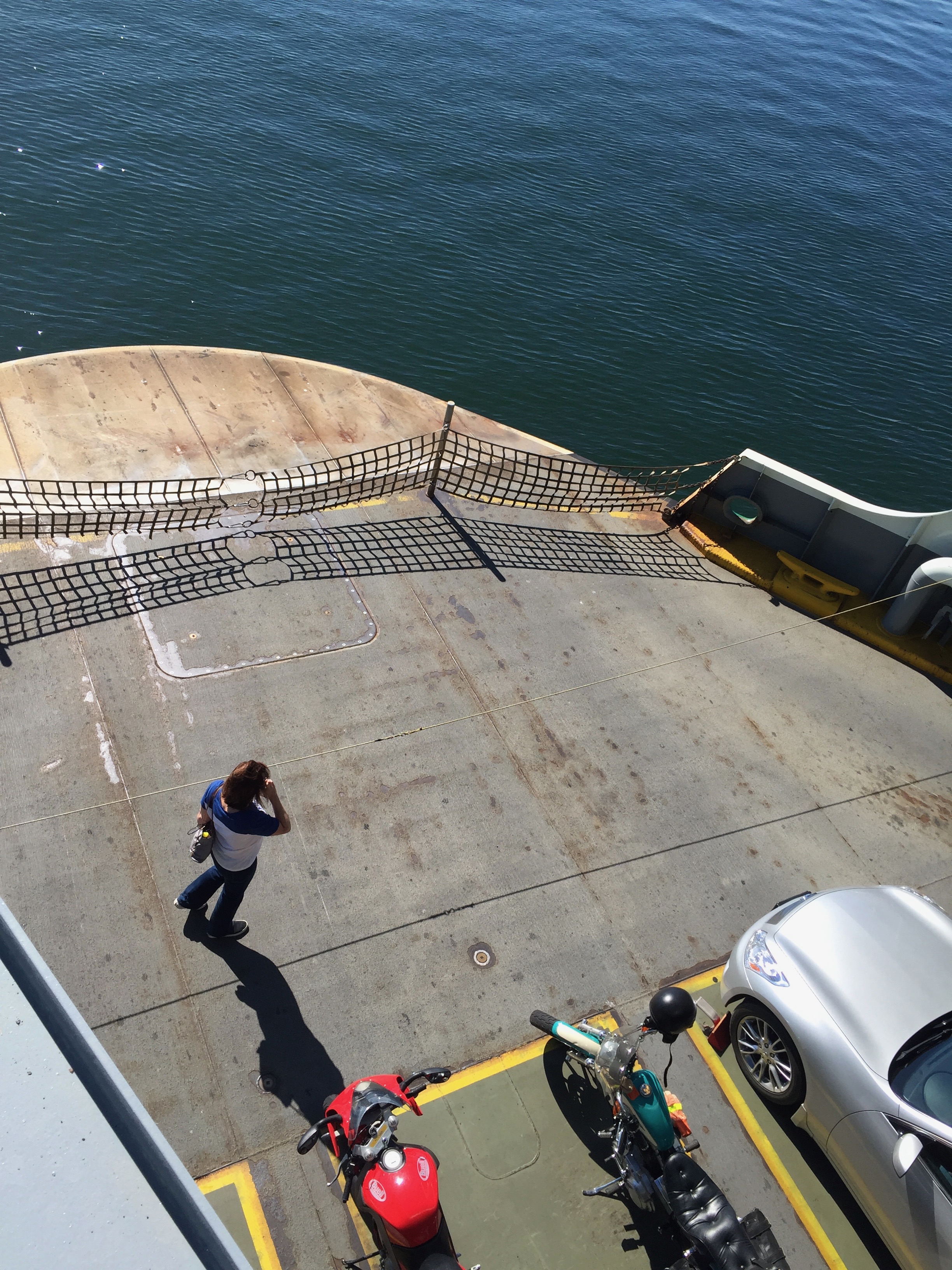 On top of the ferry looking down at the cars