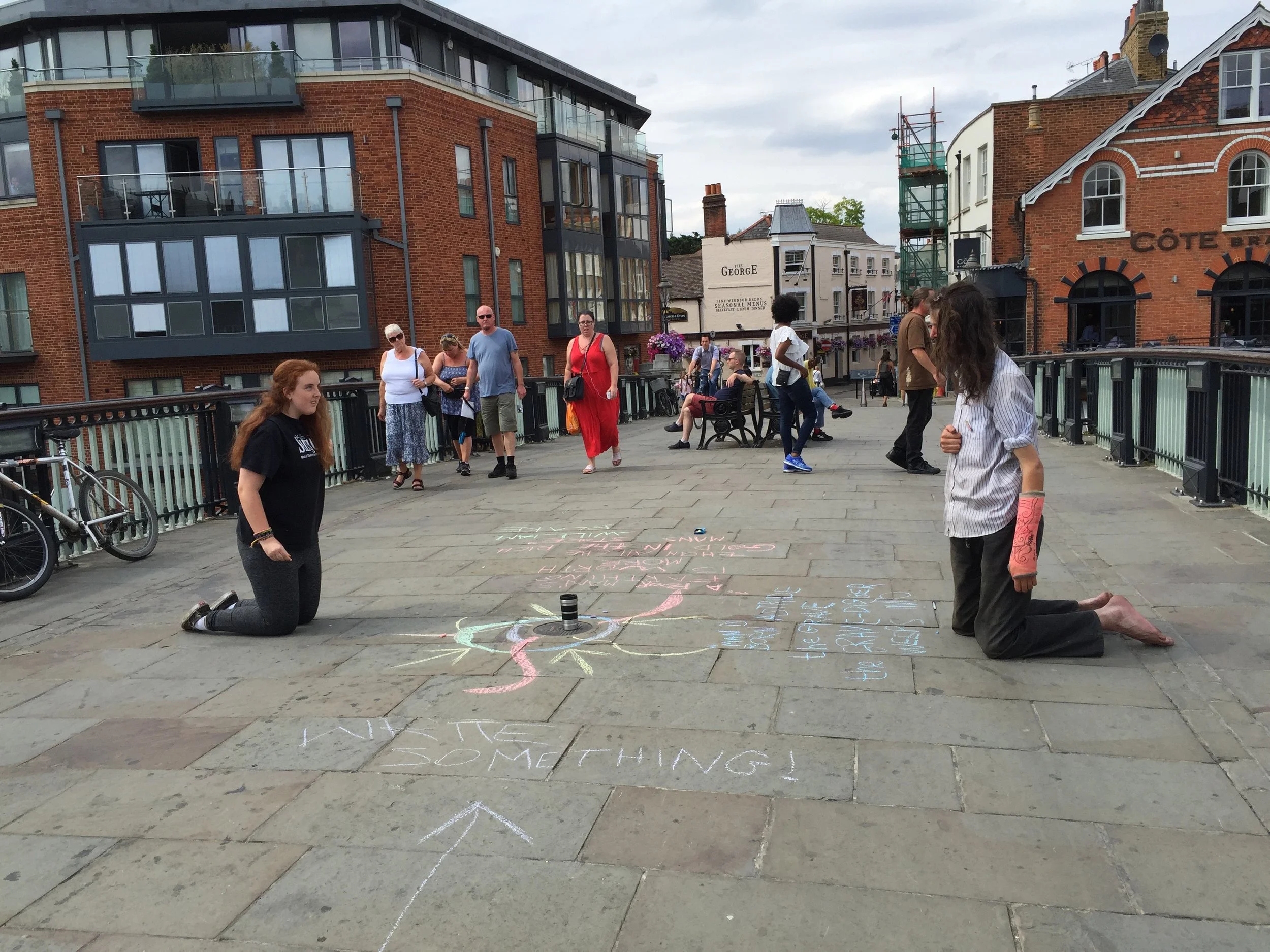 Kate striking up an artist's relationship with a local wanderer