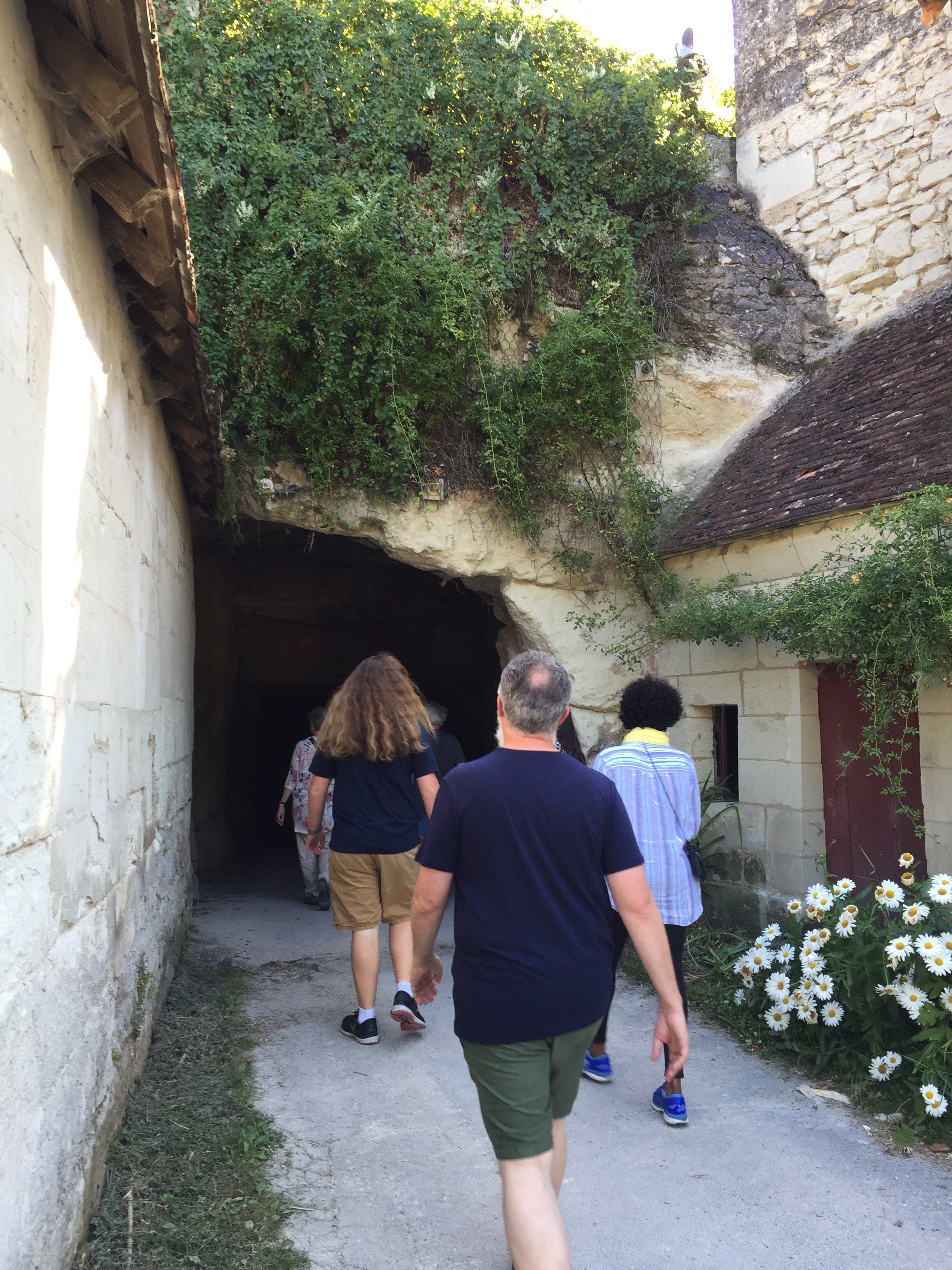 Entering Les Caves de Roche, the mushroom cave. No sign, no gate, no safety equipment required. We were told to keep up so we didn't get lost and duck under low ceilings.