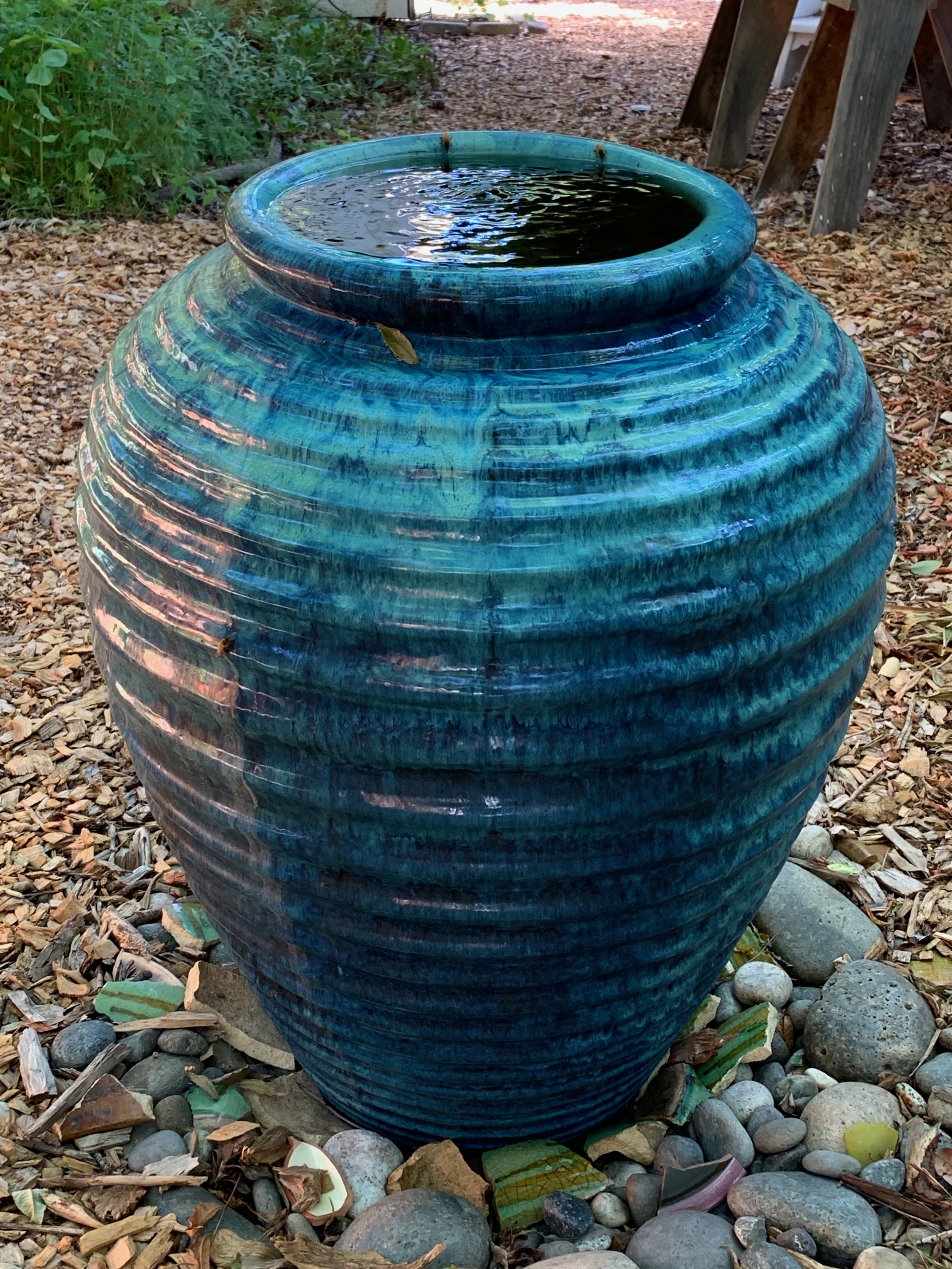 Happy fountain, with some bees taking a sip