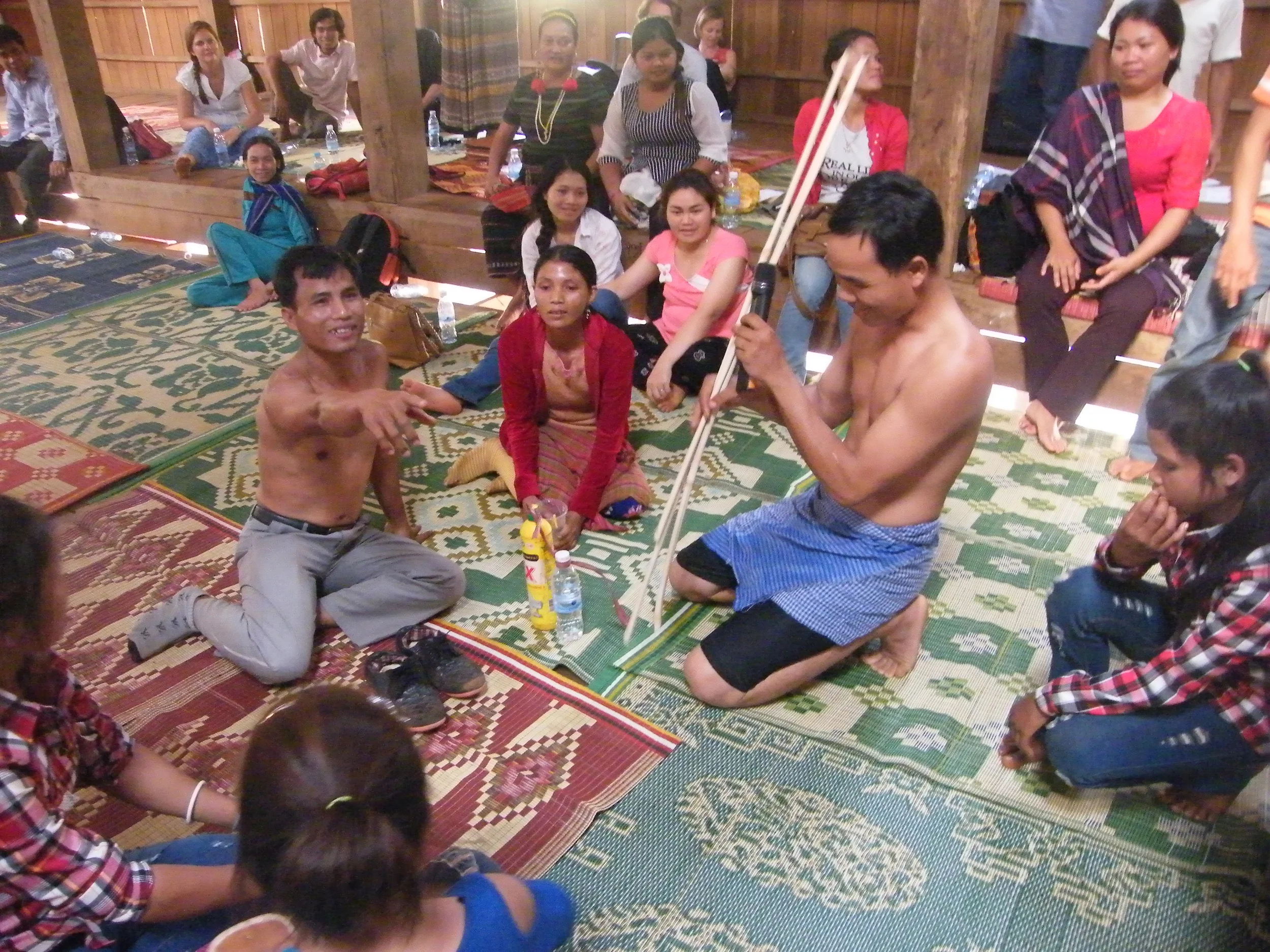 Role play of community forest protection patrol during an Outcome Harvest in Cambodia. OH first asks who is behaving differently, how and why then tries to unravel what the project contributed.