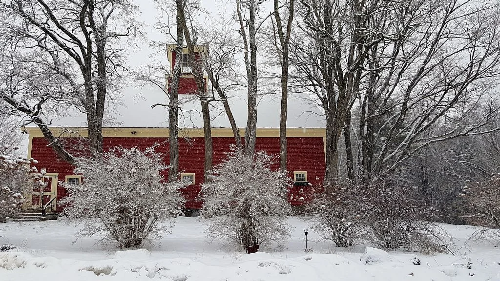 The Preserve at Chocorua Barn during a snowfall.
