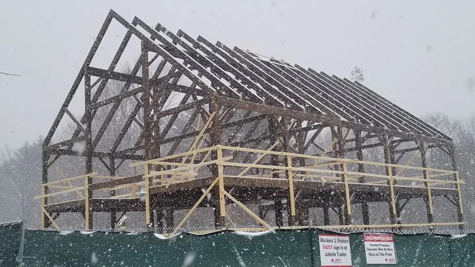 The Preserve at Chocorua TIMBERPEG frame complete. Note the tree at the far end. 