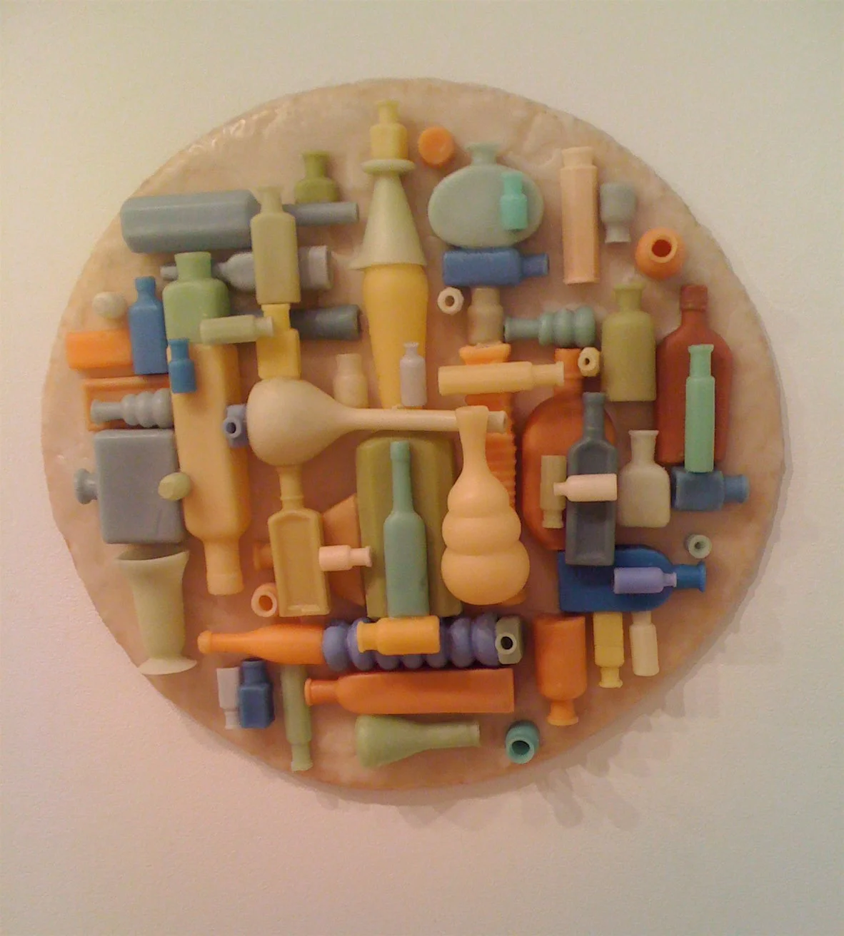 Bottletondo , 2006: beeswax, wood, 25 x 24 inches