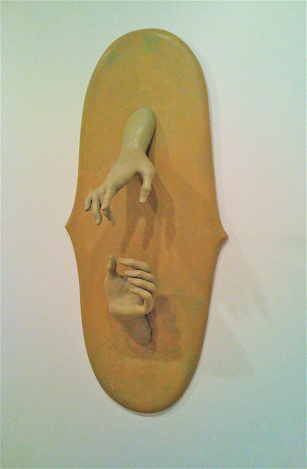 One hand speaks, the other listens, 1998: wax, wood, oil paint, 30 x 14 x 7 inches