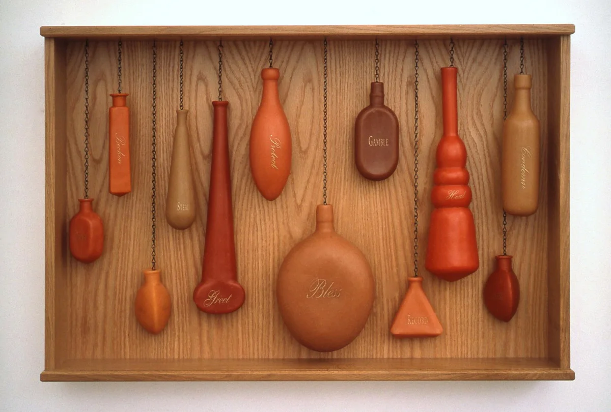 Hand Language, 1998: 27 x 42 x 5 inches, wood, wax, metal leaf. Each word refers to the gestures or actions of hands in paintings-- bless, condemn, gamble, greet, etc.