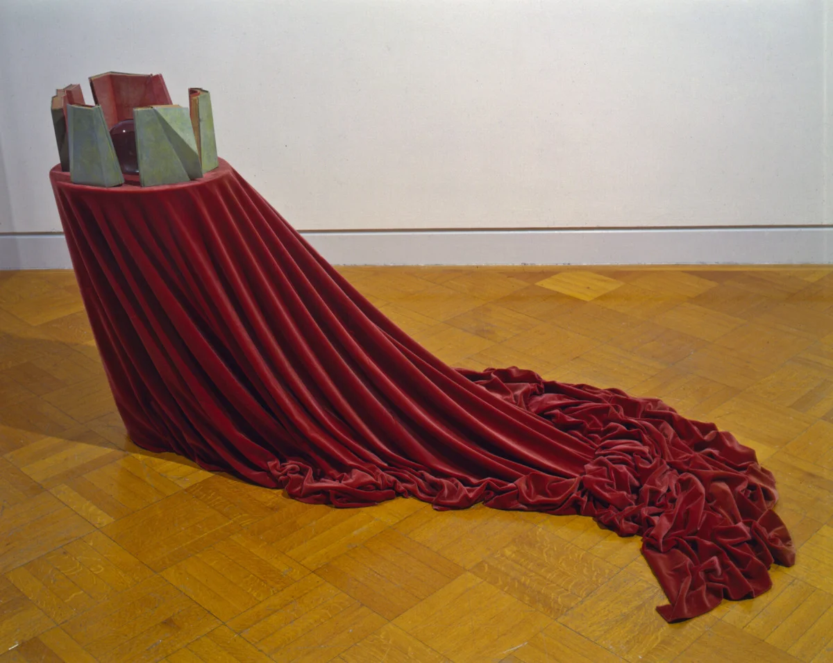 Old Science, 1992: books, glass, applied text, wood, velvet, 40 x 80 x 32 inches. On the inside of the book sculptures, facing the 'crystal ball,' there are five words, one on each: Health, Fame, Wealth, Respect, and Happiness.