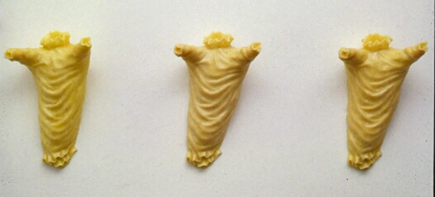 Angelology, 1993: beeswax, 22 x 60 x 8 inches. The clothes that angels would wear if they had bodies-- which they don't. 