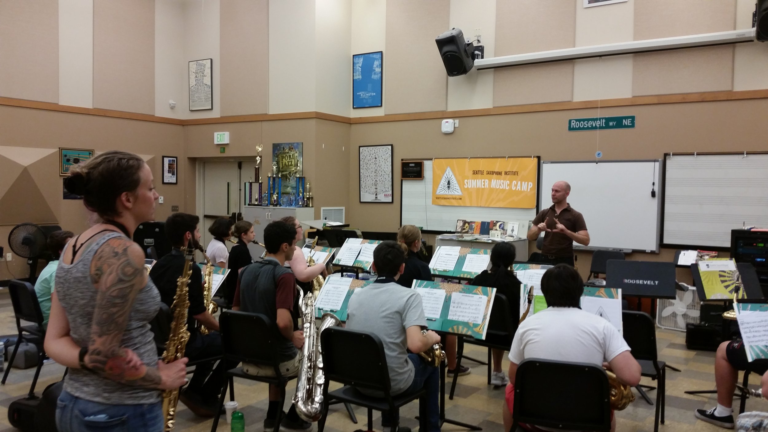  Sax Institute coach Kate Olson looks on and learns along alongside students during a guest artist presentation and performance 