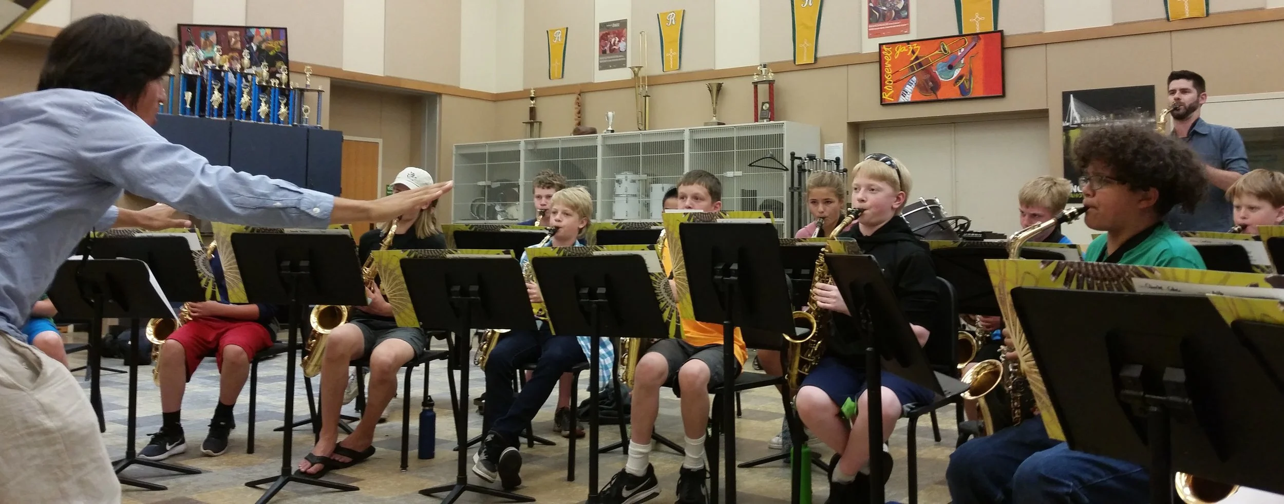 Camp coach Ivan Arteaga conducts the large-ensemble at the Middle School session.