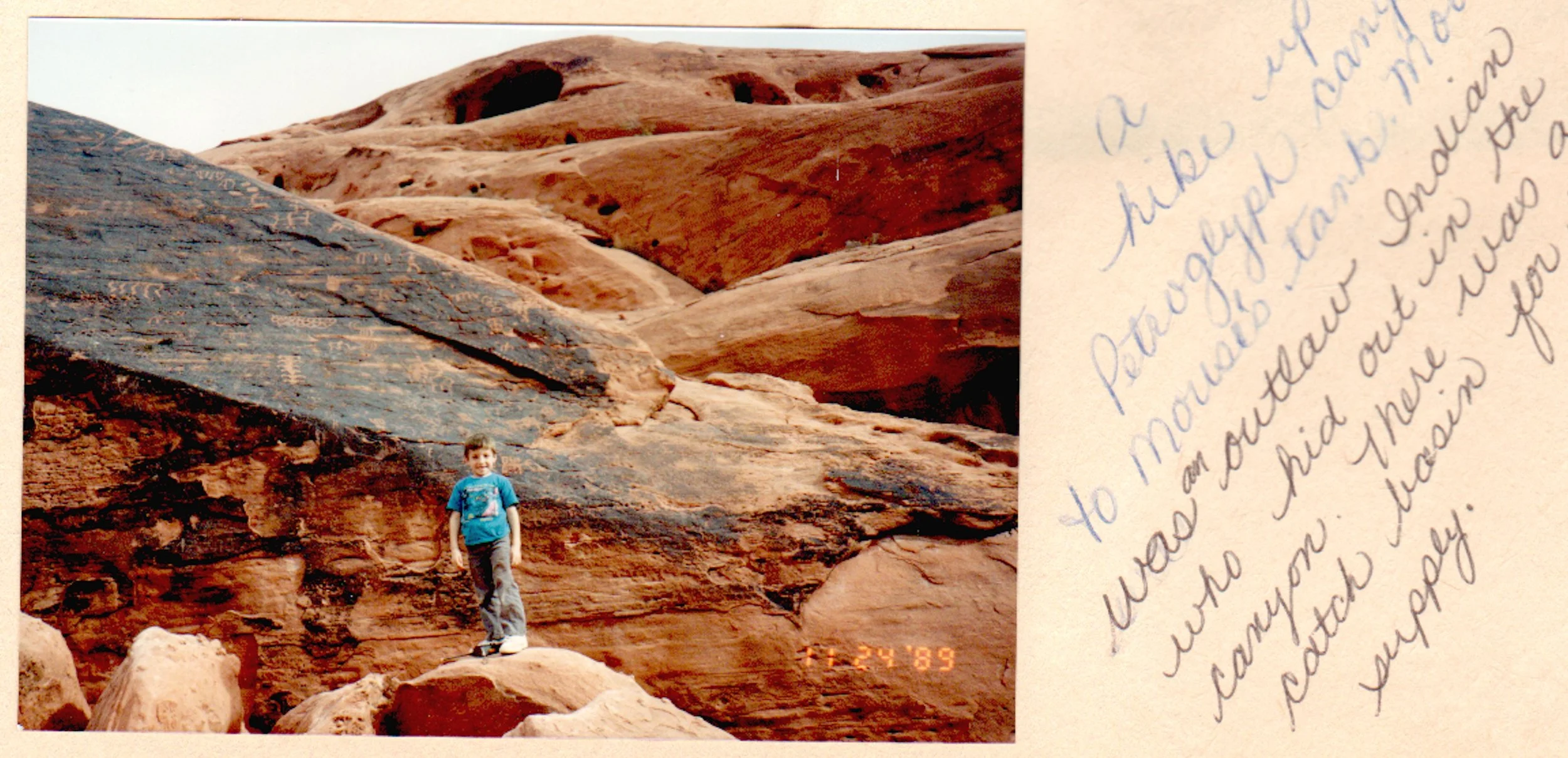 Scott, age 7, in front of some petroglyphs along Mouse's Tank Trail