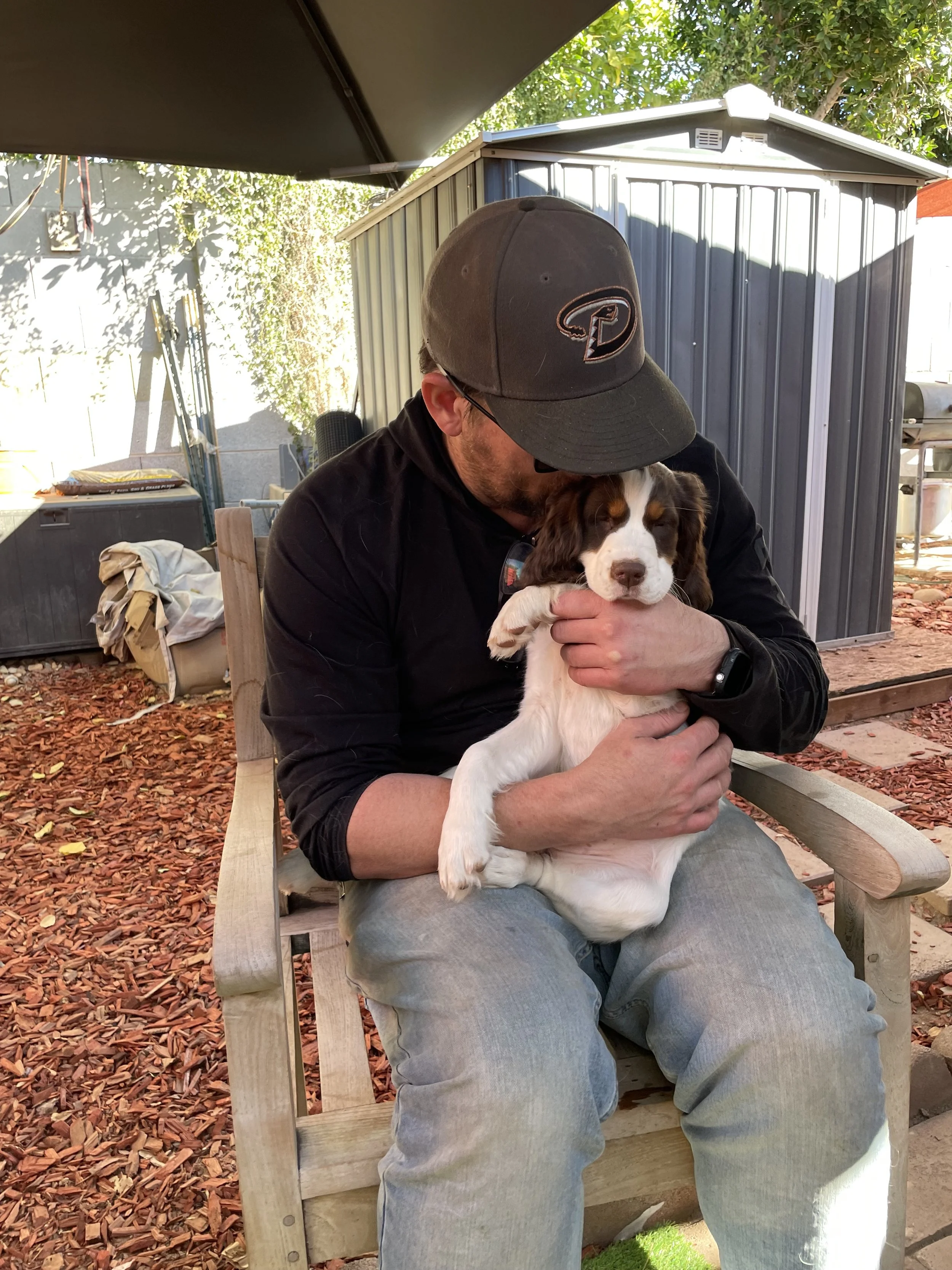 Demitri, saying goodbye to his last pup. 