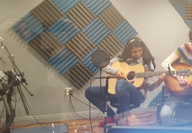 Stevenson Freshman Suki Mohan recording during her guitar lesson with Mike Walsh.