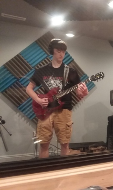 Liam shredding away during his metal song recording in the guitar lesson with Mike Walsh.