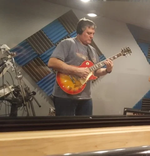 Guitar student Steve Delorge of Buffalo Grove recording like the king in his guitar lesson.