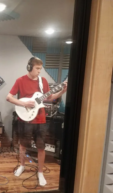 Stevenson Junior Zach Melcher jams out on recording number 19 in his guitar lesson.