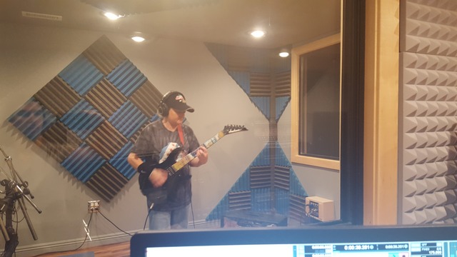Northbrook student Alison Meyers records another rock song in her guitar lesson with Mike Walsh.