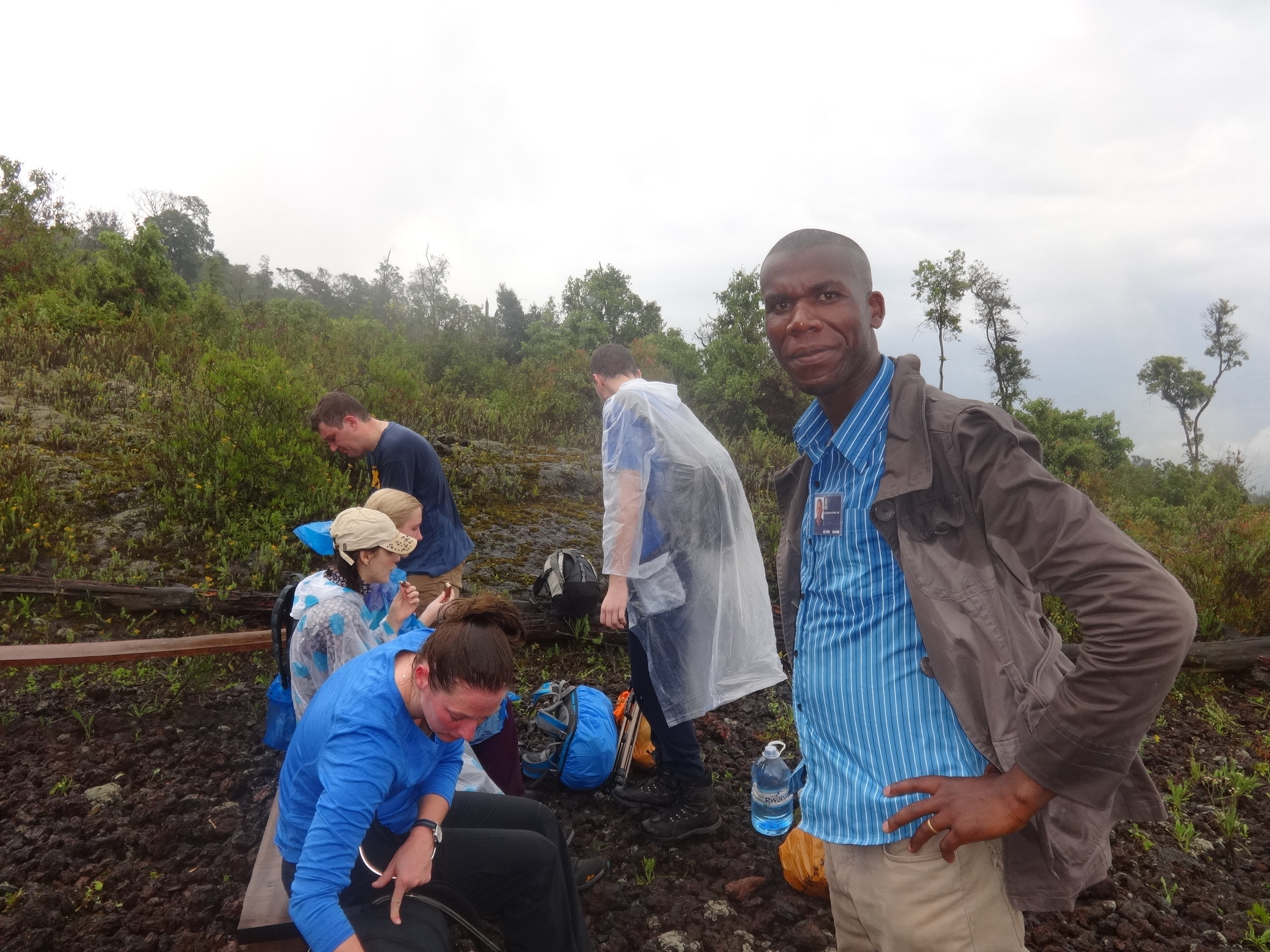 After awhile trekking upwards to the summit of nyiragongo volcano there came a downpour but good enough they were prepared.