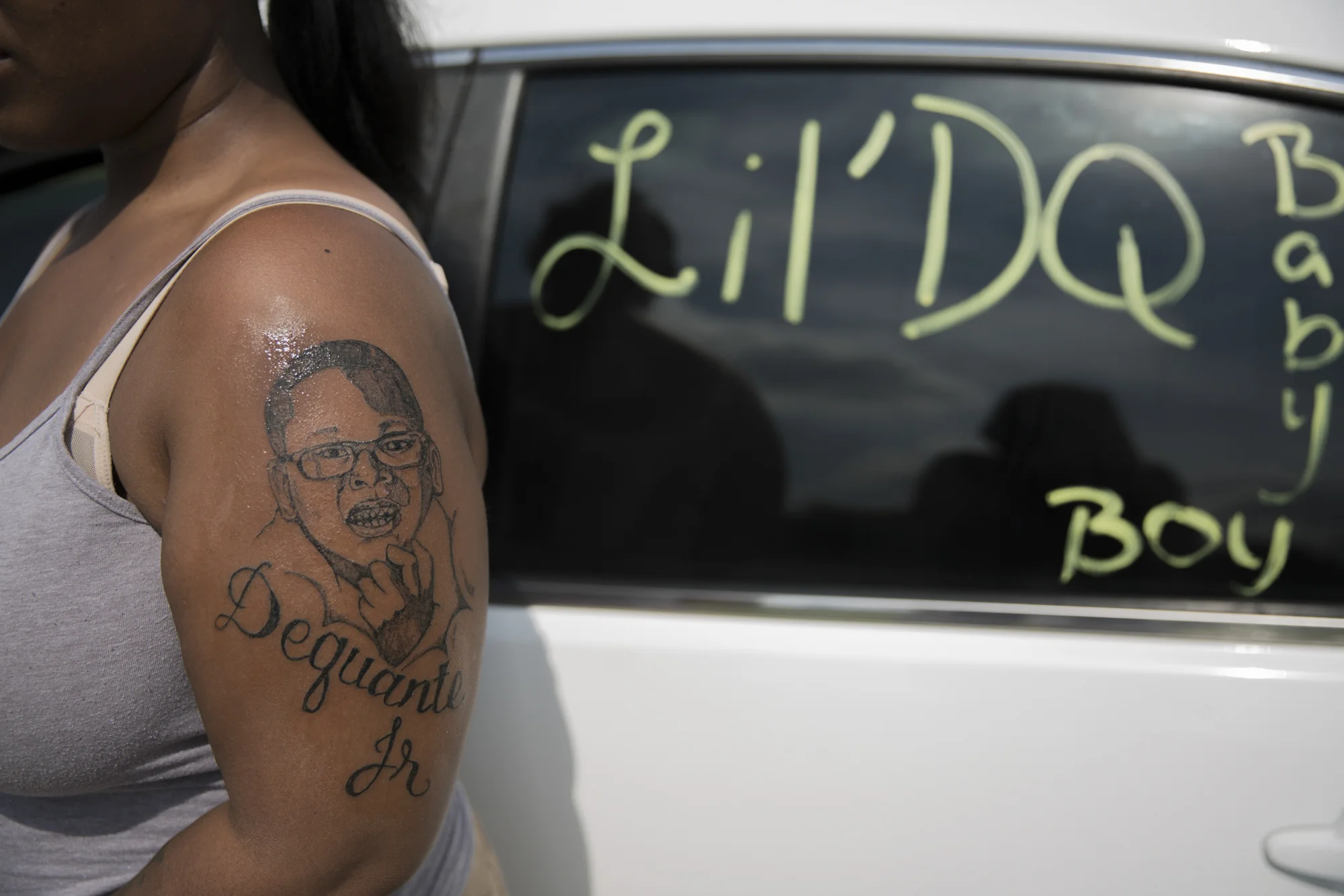 The accident struck while Dequante was eating cake two days before his first grade graduation. Micheshia tattooed her arm with her son's face and reminds the Louisville community of her loss by diligently painting her car windows in memory of him.