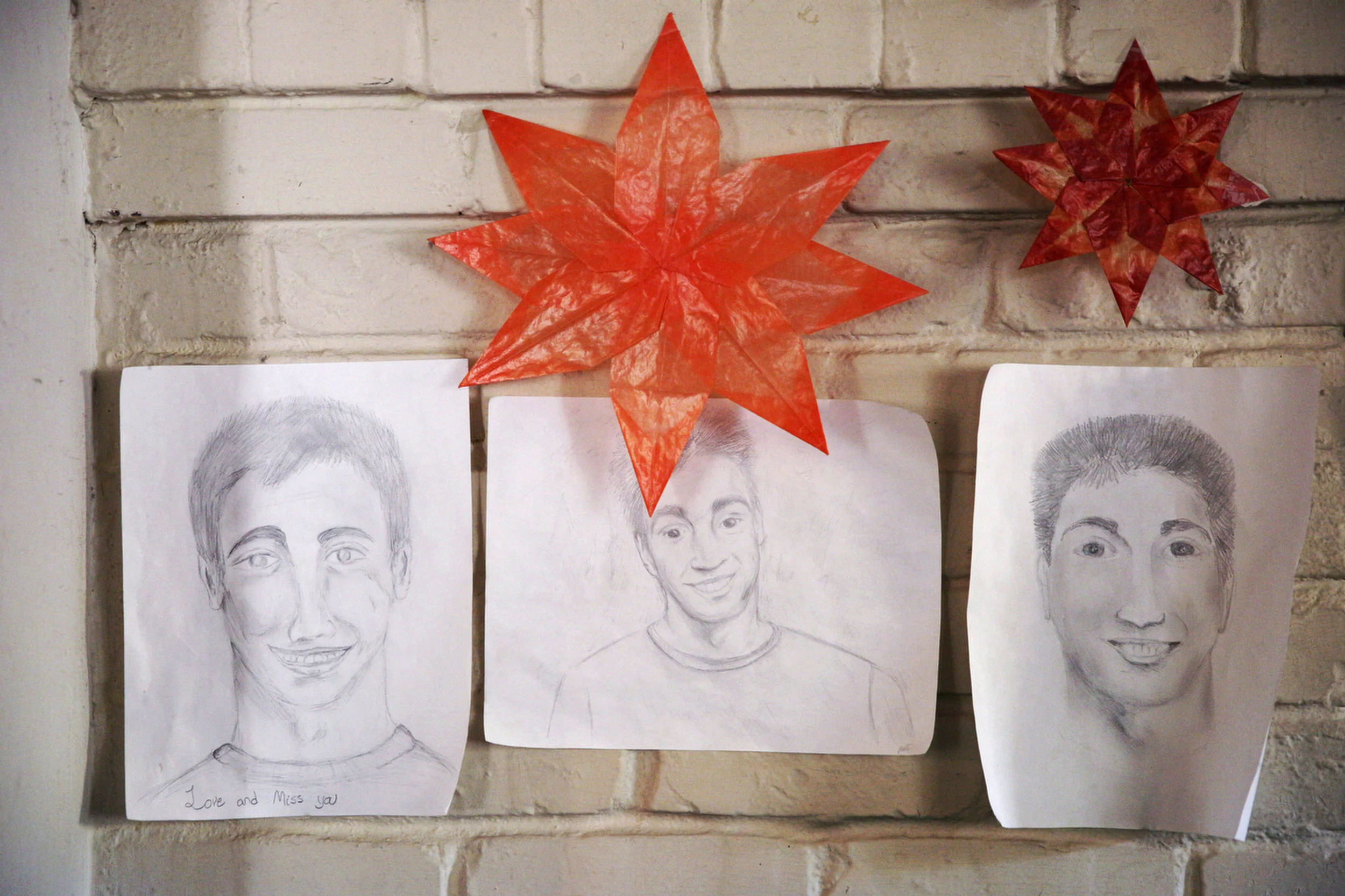 Drawings of Kyle hang at his home in Sacramento. His classmates drew the portraits a few days after his death, and his family has never taken them down.
