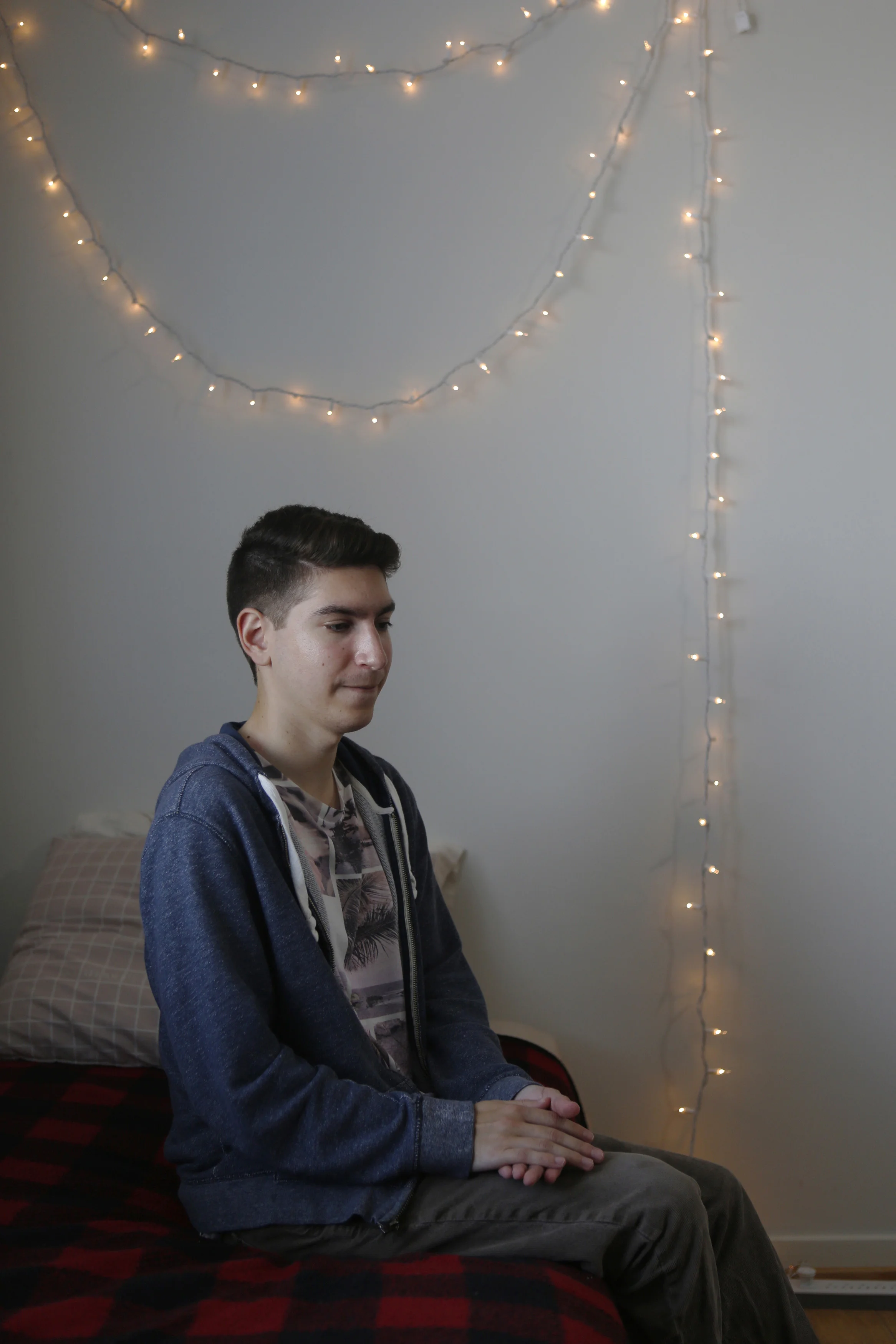 Manuel Gamboa III sits on his bed in San Francisco. He is two years older than his brother Kyle and says that he never told him that he was struggling with anything. Manuel's favorite last memory was going to the California State Fair weeks before Kyle's death and spending time together – just the two of them.