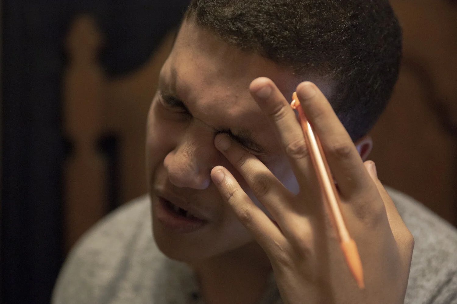 Mr. Byrd rubs his eyes while doing homework. For a journalism paper, he researched a website that didn't have a mobile version and struggled to read the information on his phone. He gave up in frustration and turned in the paper with minimal researc