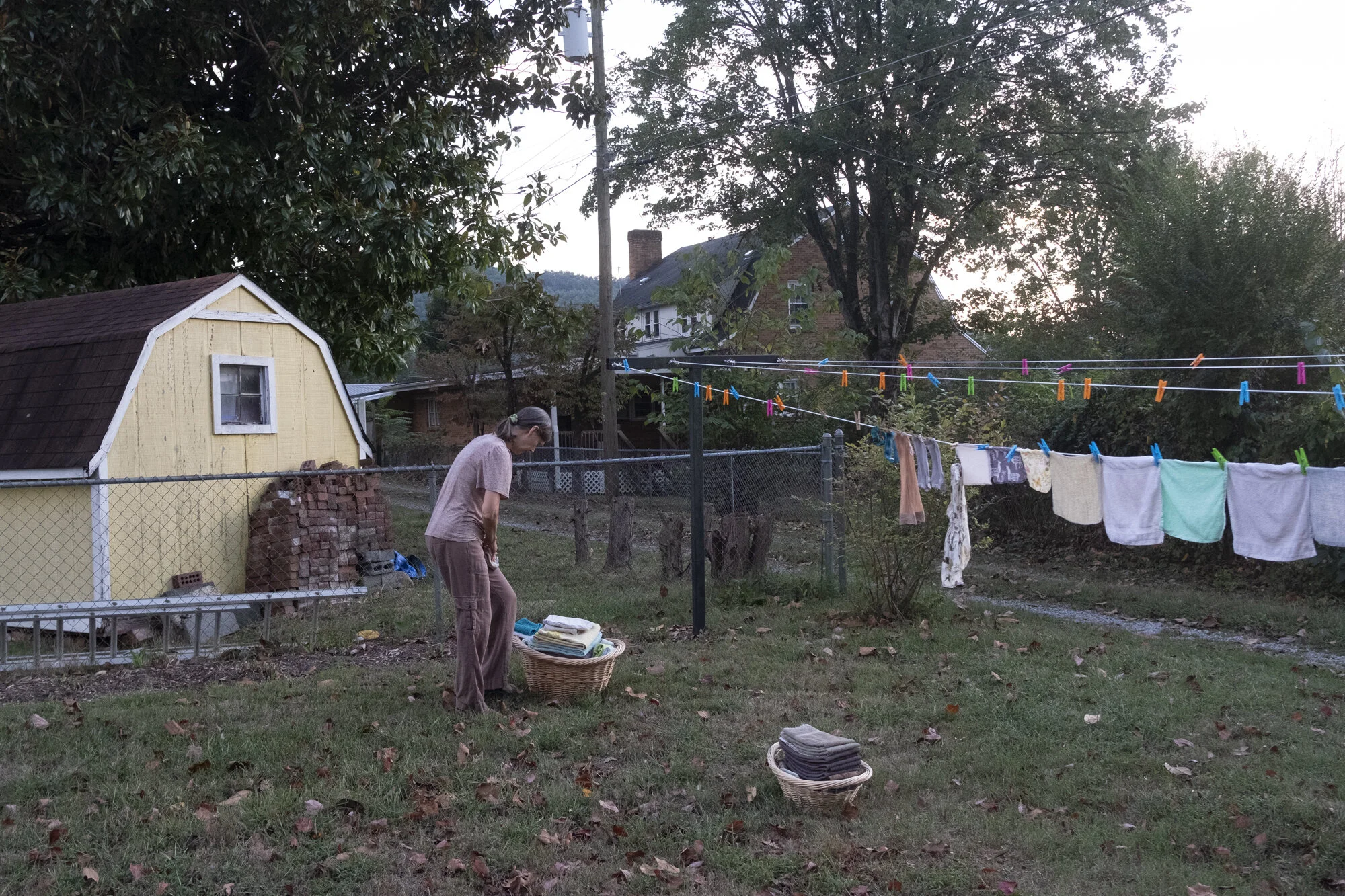  Mary hangs laundry to dry on a summer day when the dryer malfunctioned. She worked as a nurse for a couple years but later dedicated all her time to raising and homeschooling their children.  
