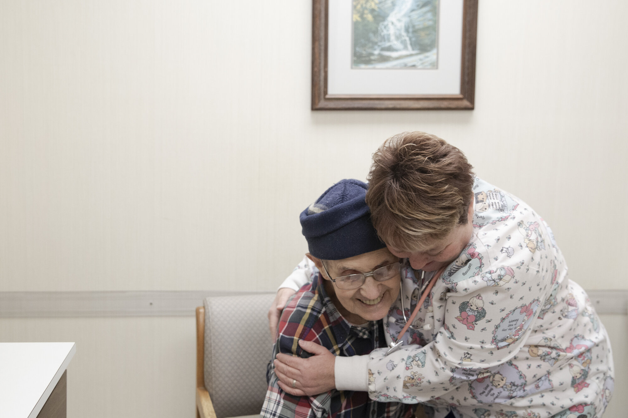 Receptionist, Tina Jones, hugs patient, Jack Stallard. “She’s prayed for me!” he exclaims.
