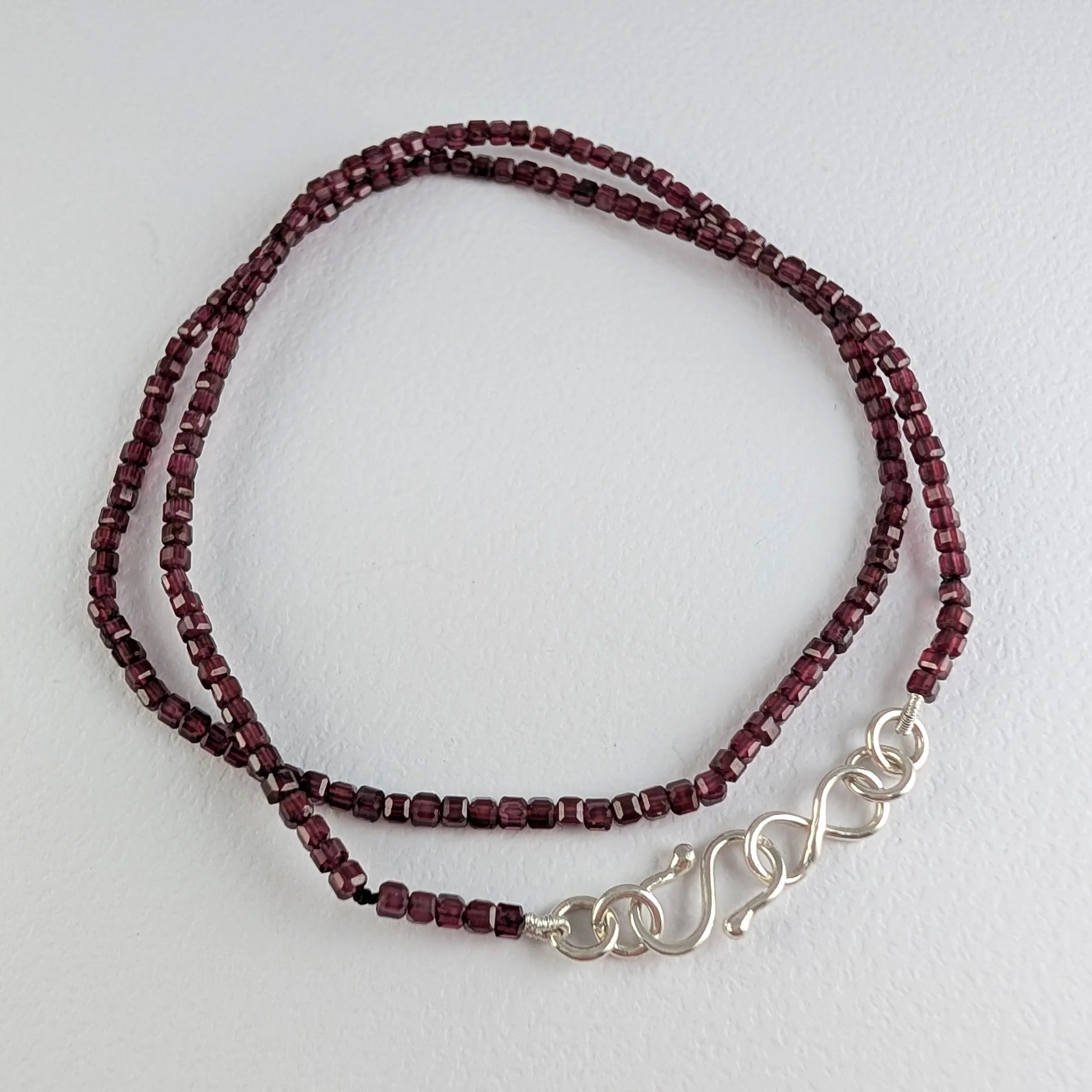 Knotted Garnet Tiny Cubes Necklace on Silk v1.jpg