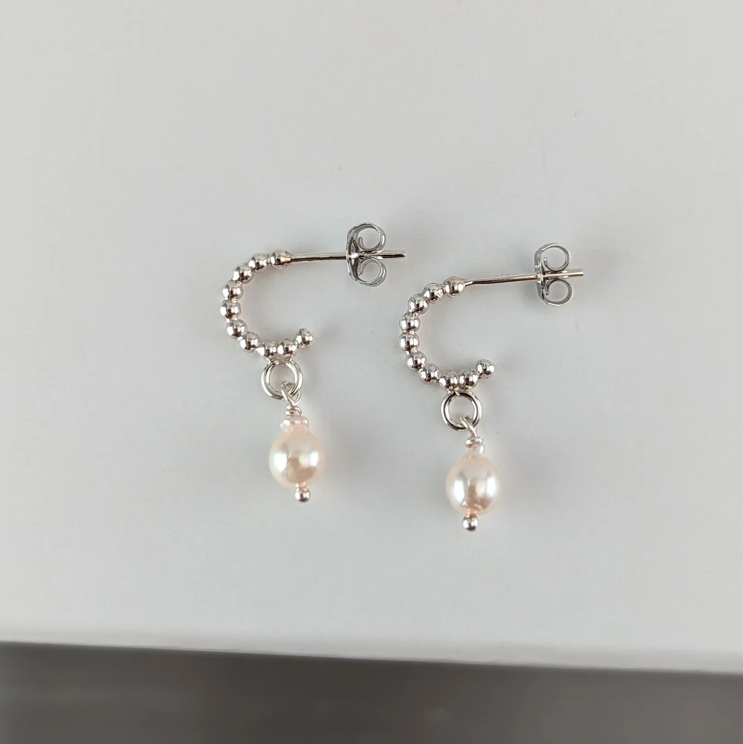 Tiny beaded wire hoops with baroque pearls