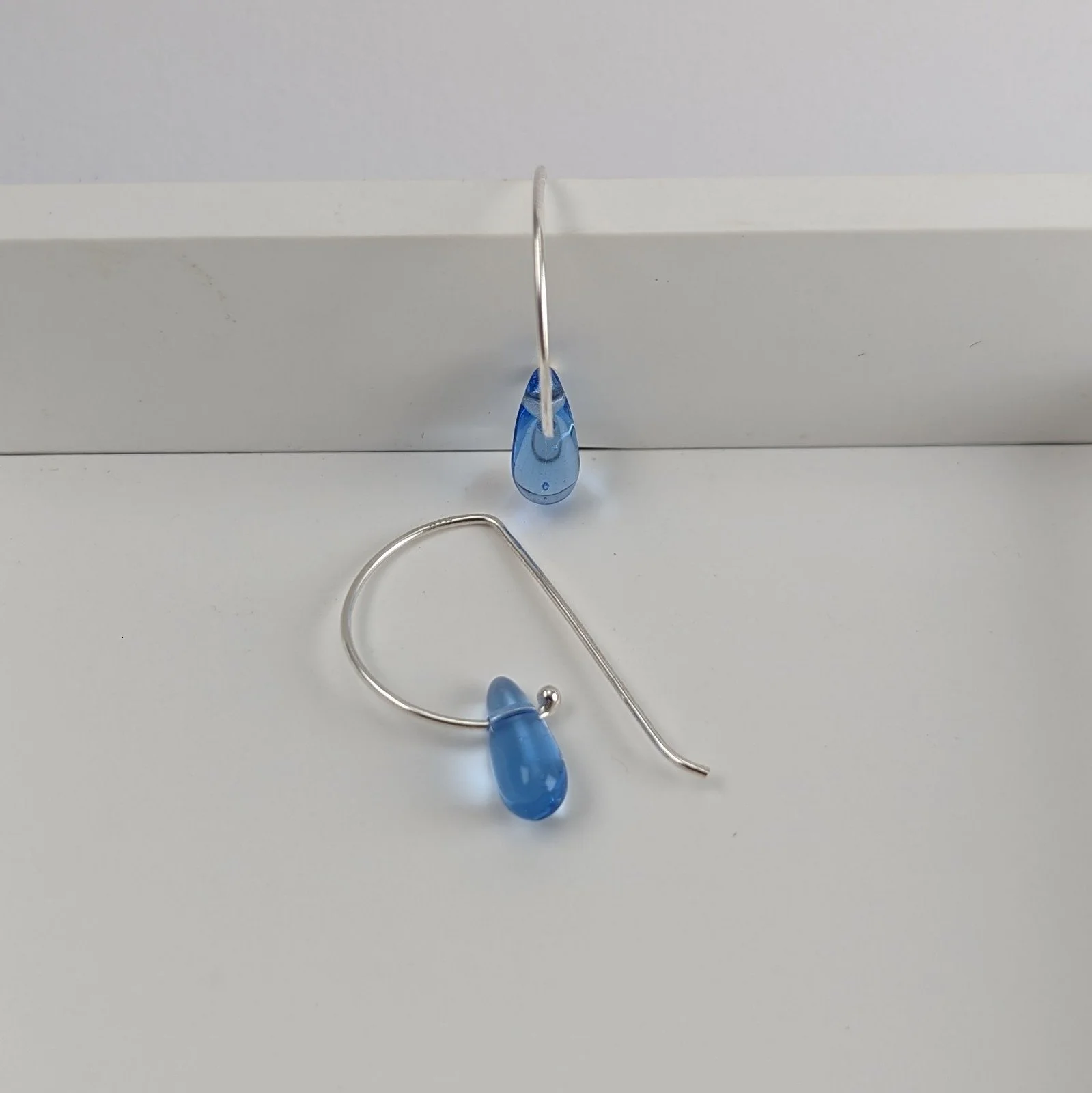 Light blue tiny glass teardrop earrings