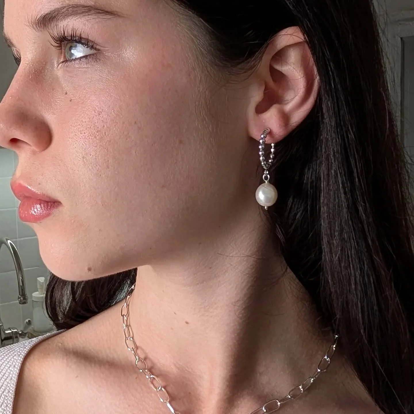 The days are getting warmer and I'm starting to pull out a few lighter clothes to wear. My handmade sterling silver hoops are perfect for the summer weather with gorgeous white freshwater pearls. I'm loving this look with a crisp white top. Paired he