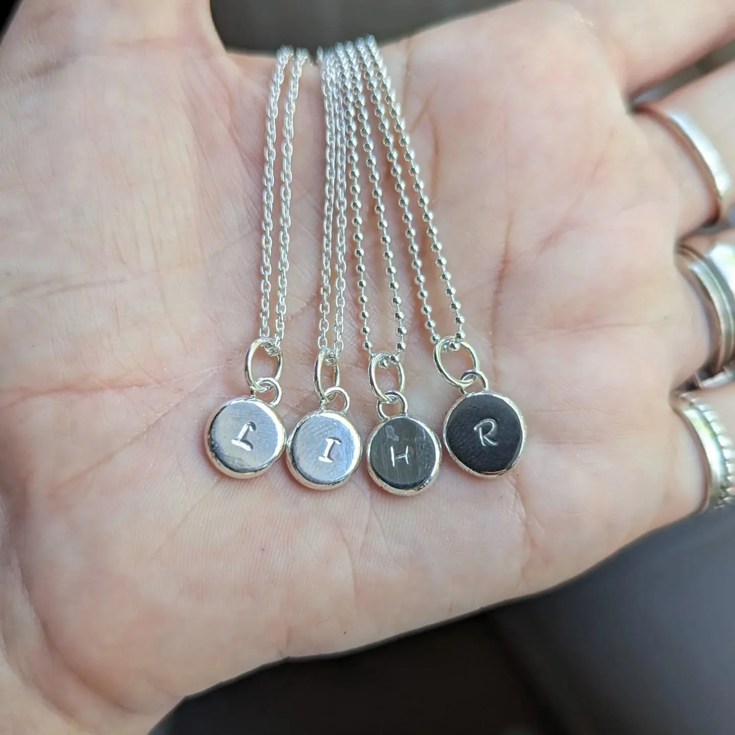 Melted recycled sterling silver, hammered and soldered to create the sweetest pendant to create your own individual pendant stack. Handmade in Brisbane in my studio especially for you. Select your initial when adding to cart on my website. These pend