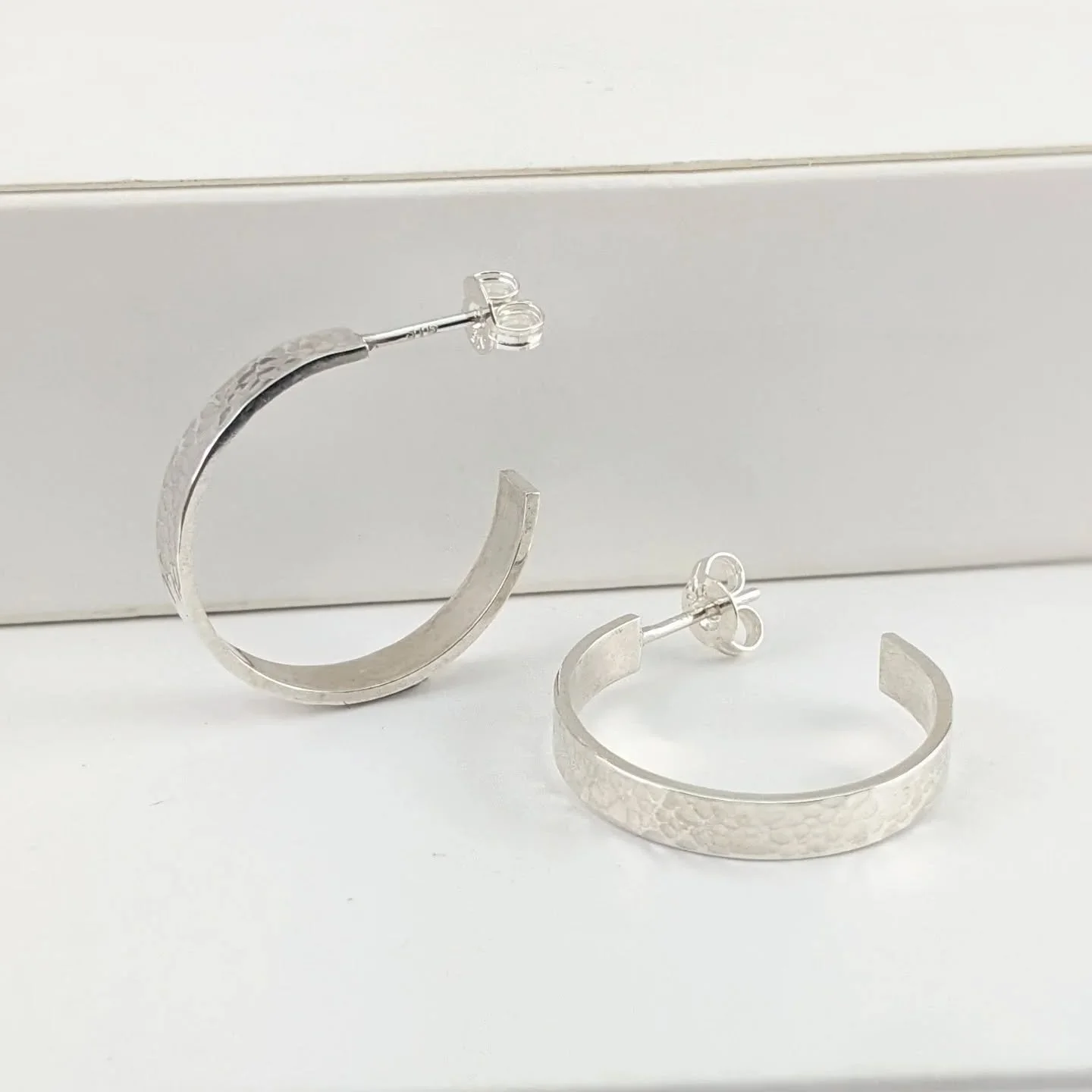Classic and functional for everyday, these hammered texture hoop earrings will go with everything. Handmade from sterling silver in Brisbane, Australia by artisan jeweller Georgina (me). 

I have two sizes of this style and they also come in a polish
