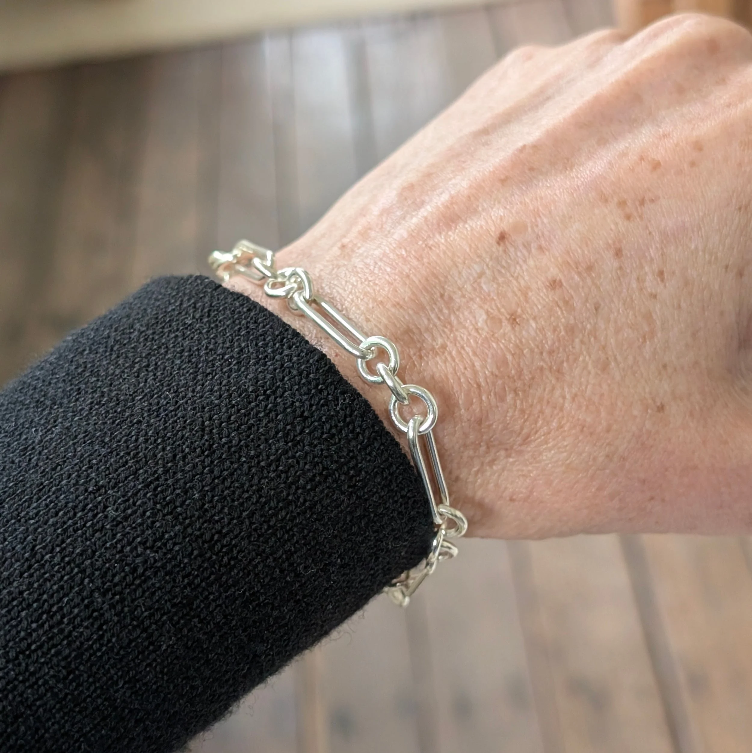 Handmade-Paperclip-Bracelet-with-Three-Jump-Rings-on wrist.jpg