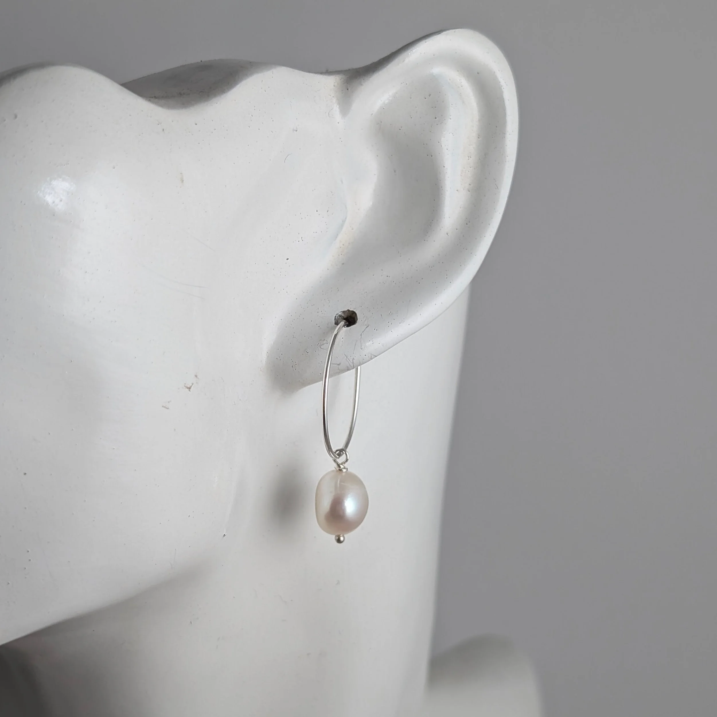 Short-hoop-semi-baroque-pearls-on-ear.jpg