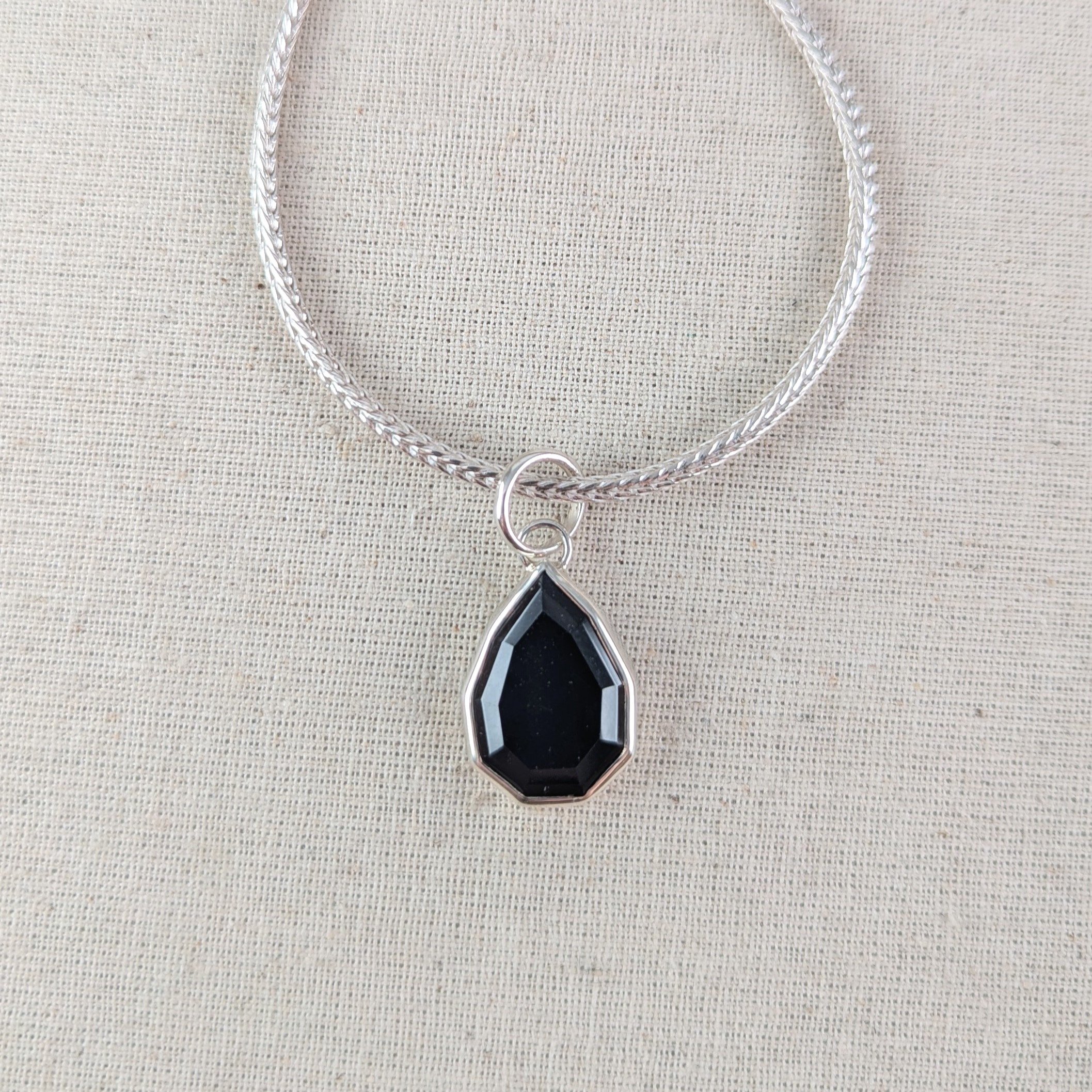 Step cut black spinel pendant
