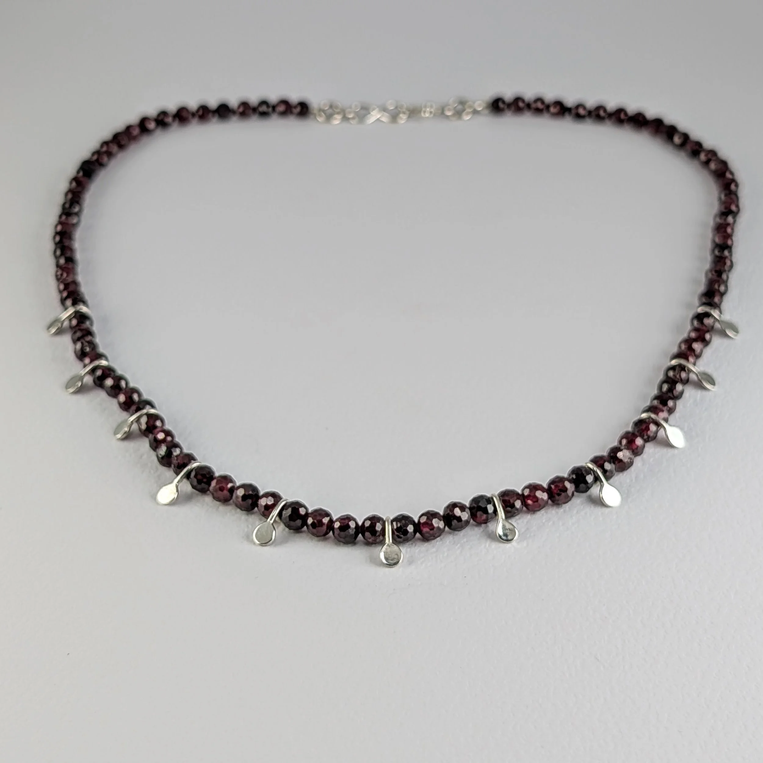 Knotted Garnet Necklace on Silk with Silver Dots