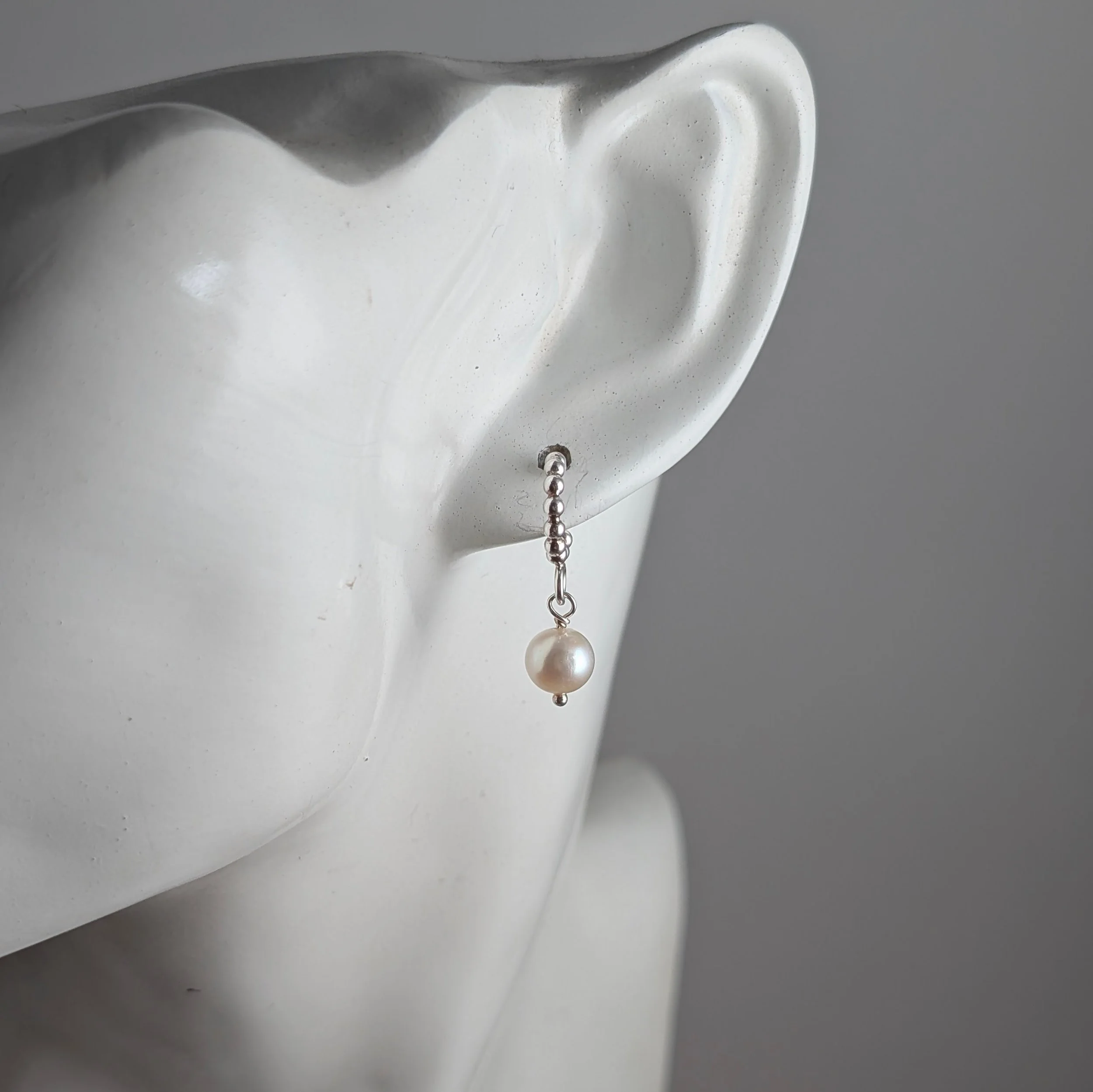 Tiny-beaded-hoops-oval-pearl-on-ear.jpg
