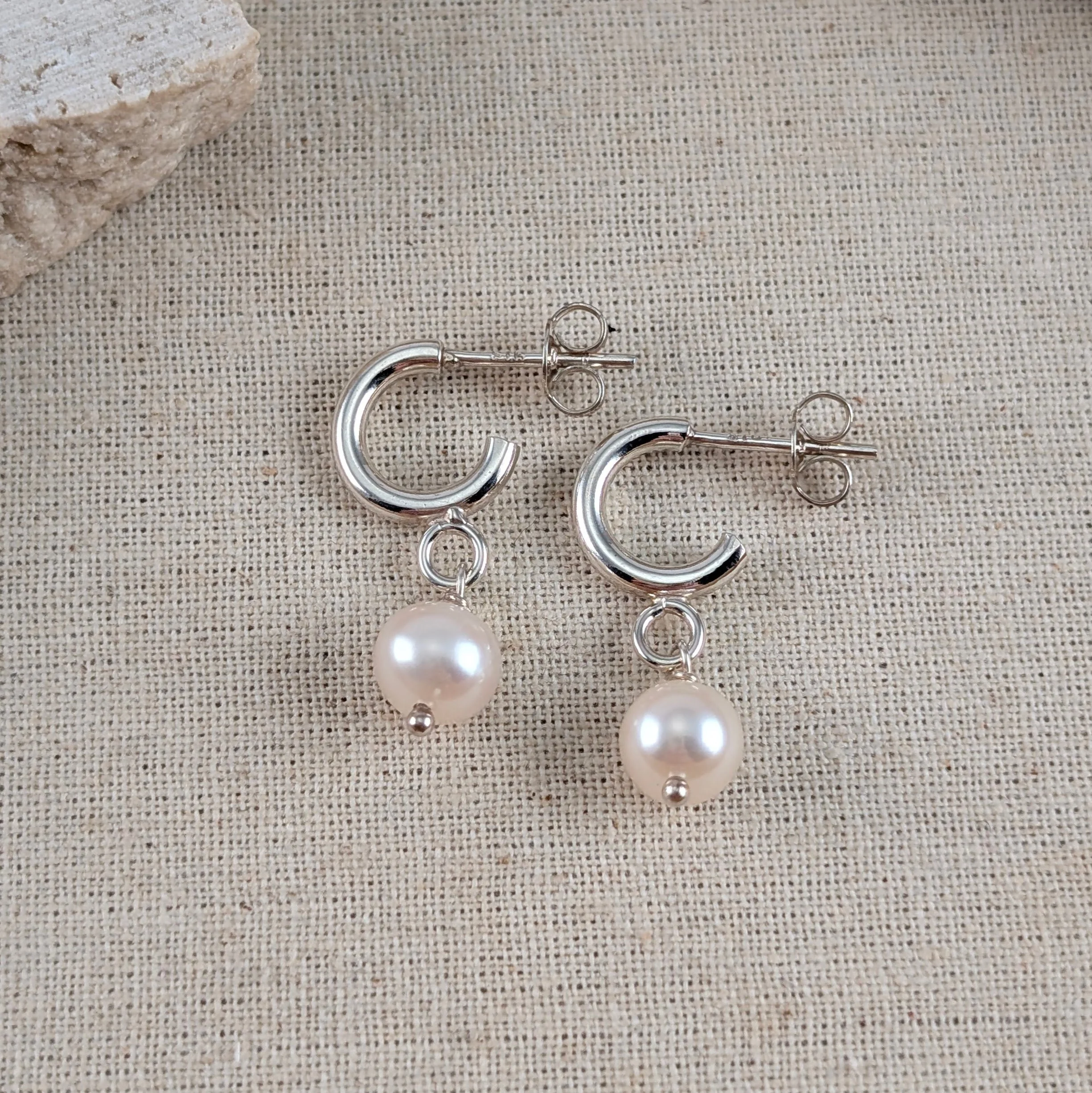 Tiny 2mm hoops with small white oval pearls